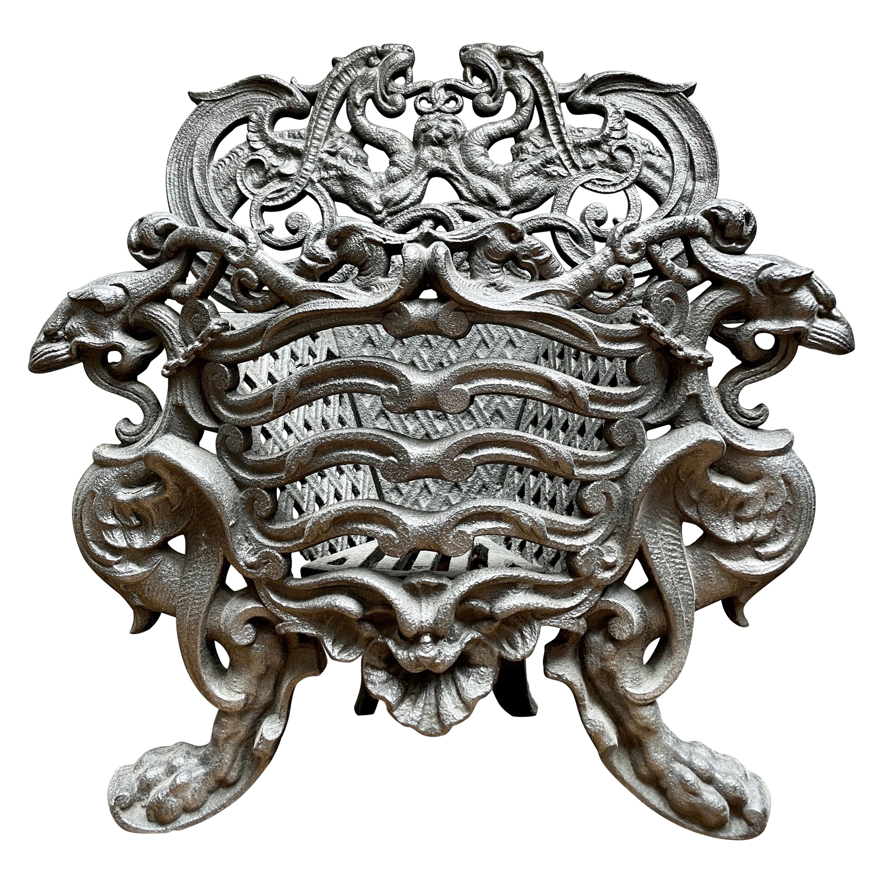 A Small  Ornate French Cast Iron Coal Grate