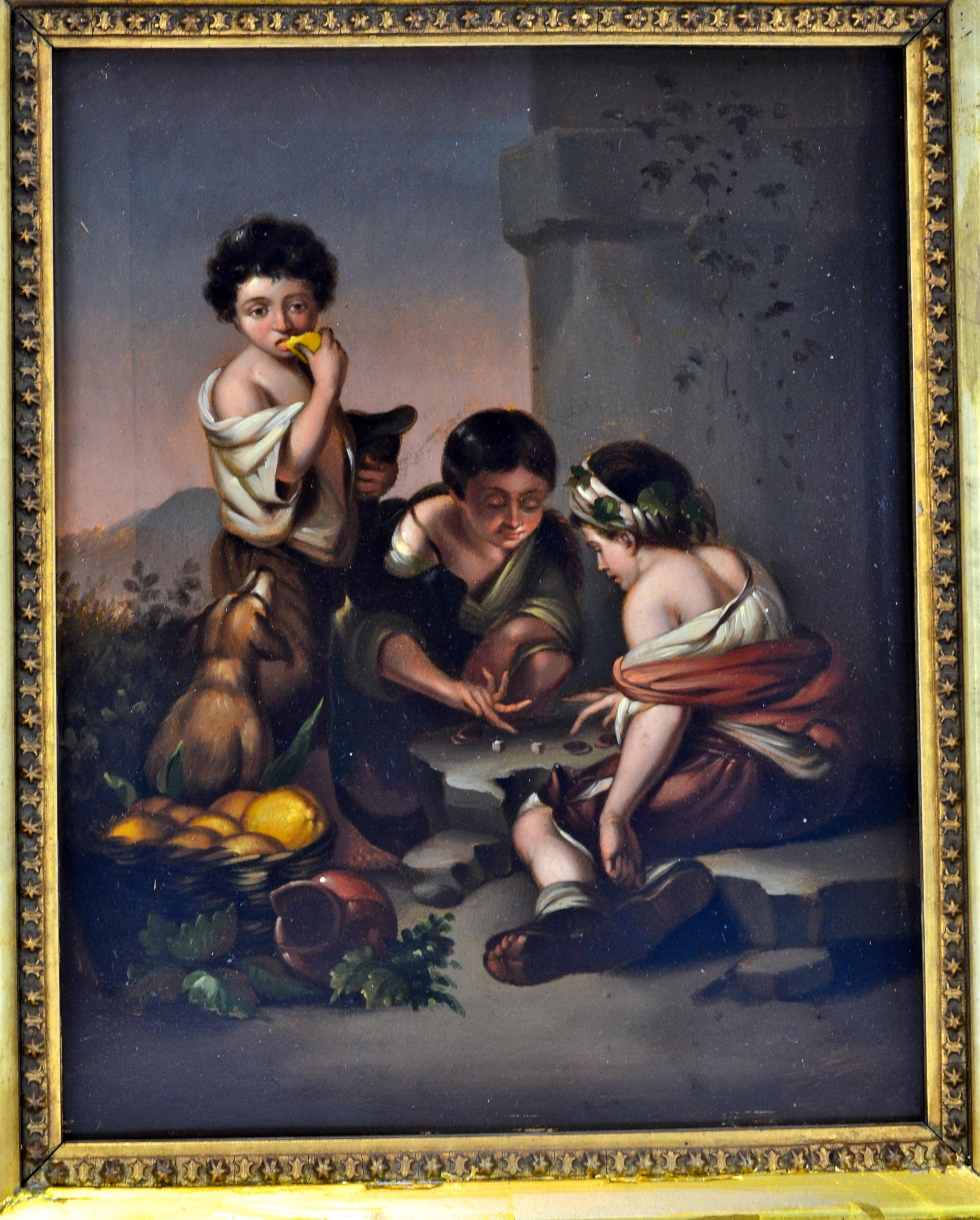 A well executed 18 century small oil painting on tin in a period gilt frame of one of the old Baroque Spanish Master Bartolomeo Estaban Murillo’s ( 1670- 1675) paintings titled “Boys Playing Dice” hanging in the Alte Pinakothek in Munich