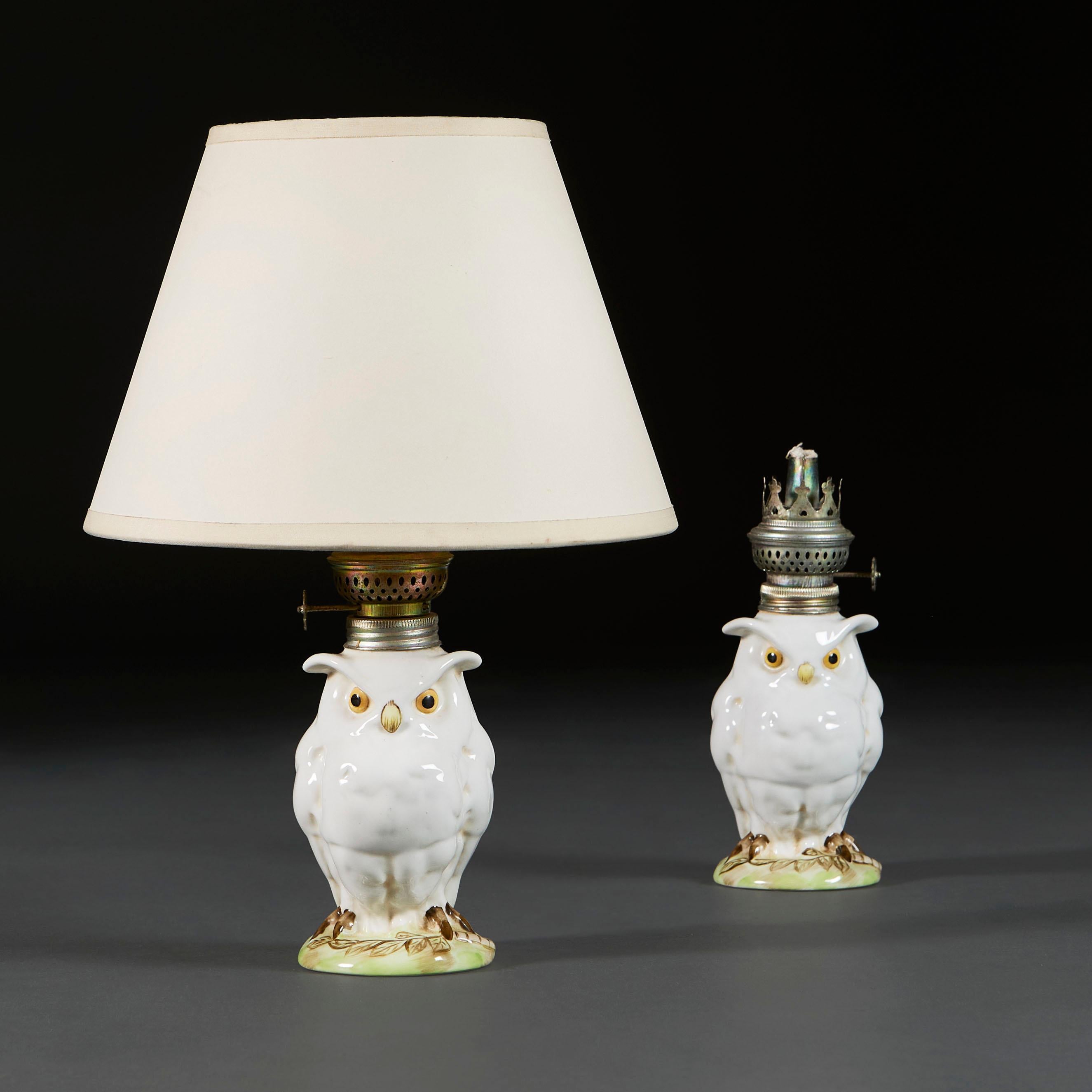 Germany, circa 1900

A pair of early twentieth century Meissen white owl lamps, the owls modelled with wings folded behind the backs, with painted yellow bead eyes and beak, and resting on a naturalistic base. Meissen stamps to the