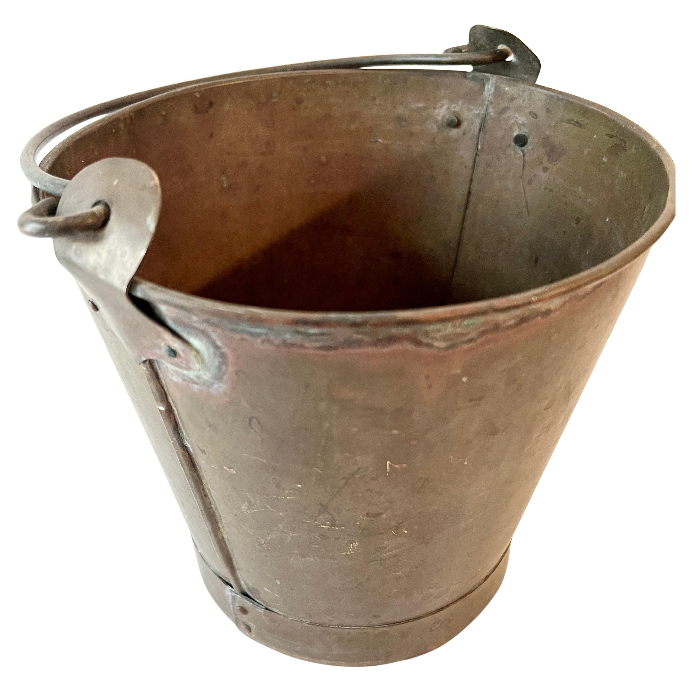 A Small Patinated Brass Pail with Handle