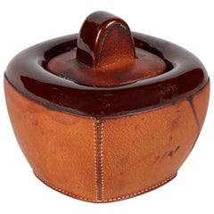 Small Pottery Jar with Brown Leather Decoration and Lid