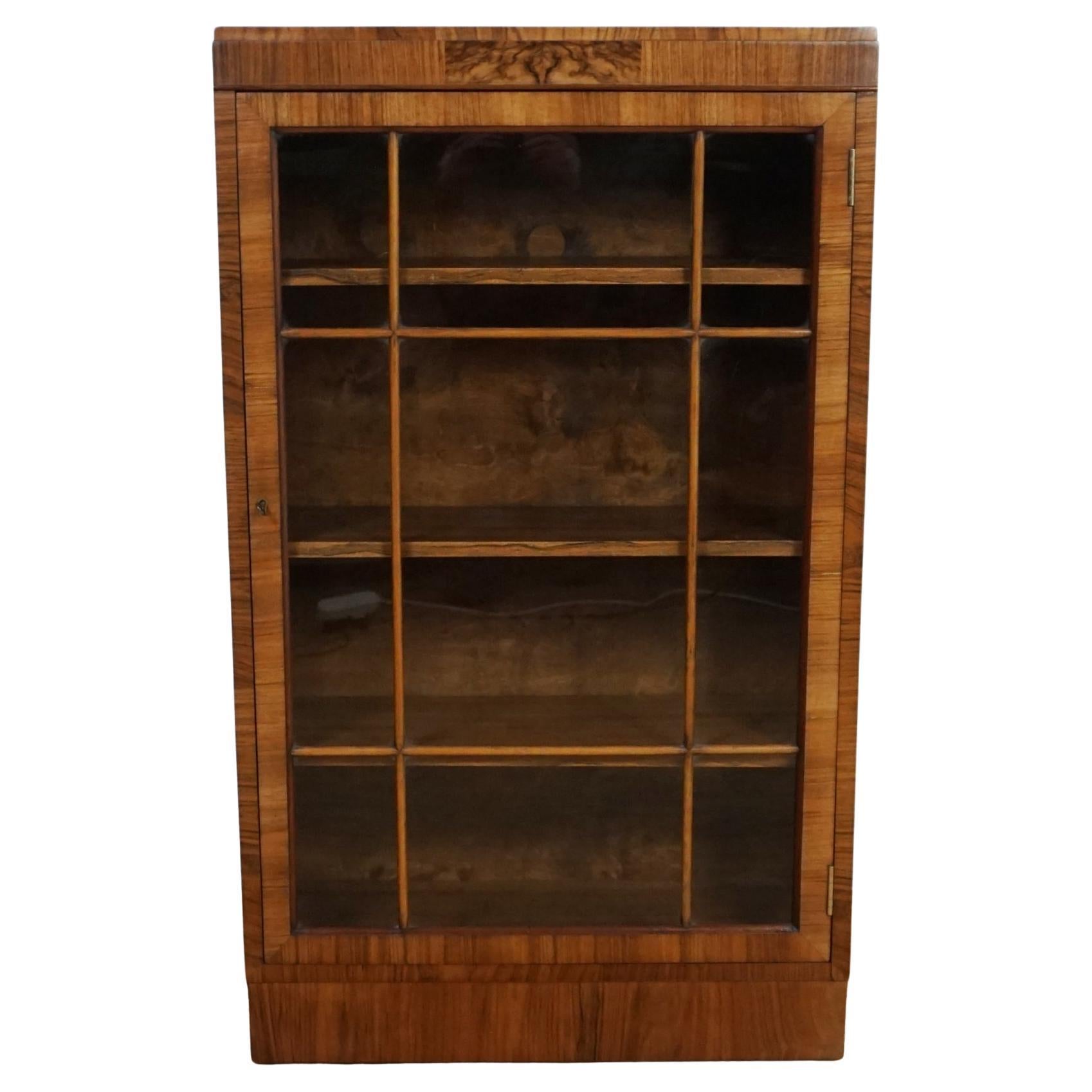 A Small Proportioned Art Deco Walnut and Glass Fronted Bookcase For Sale