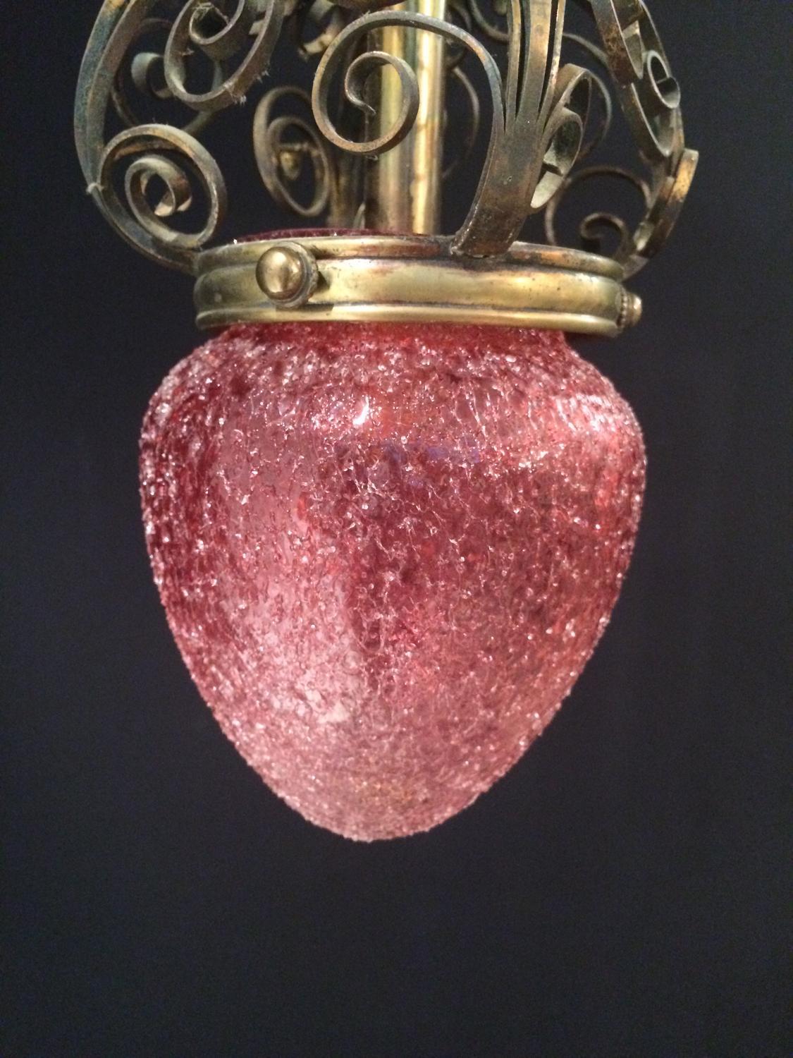 Faraday & Son light, the shade with applied drizzled cranberry glass in the form of a strawberry, circa 1900. The crown of hand wrought brasswork. English, 20th century.

The frame is register marked as Faraday & Son. Robert Faraday had a foundry