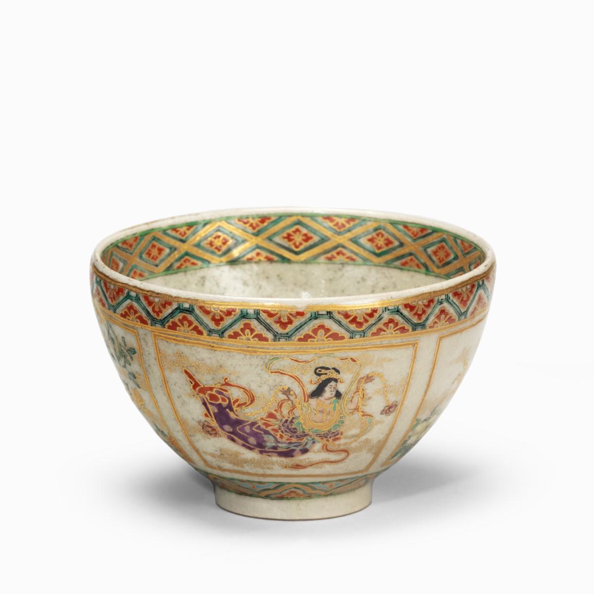 A small Satsuma earthenware tea bowl, the speckled greyish body decorated with four panels of alternating bijinand flowers, painted in overglaze enamels and gilt. Japanese, circa 1900.