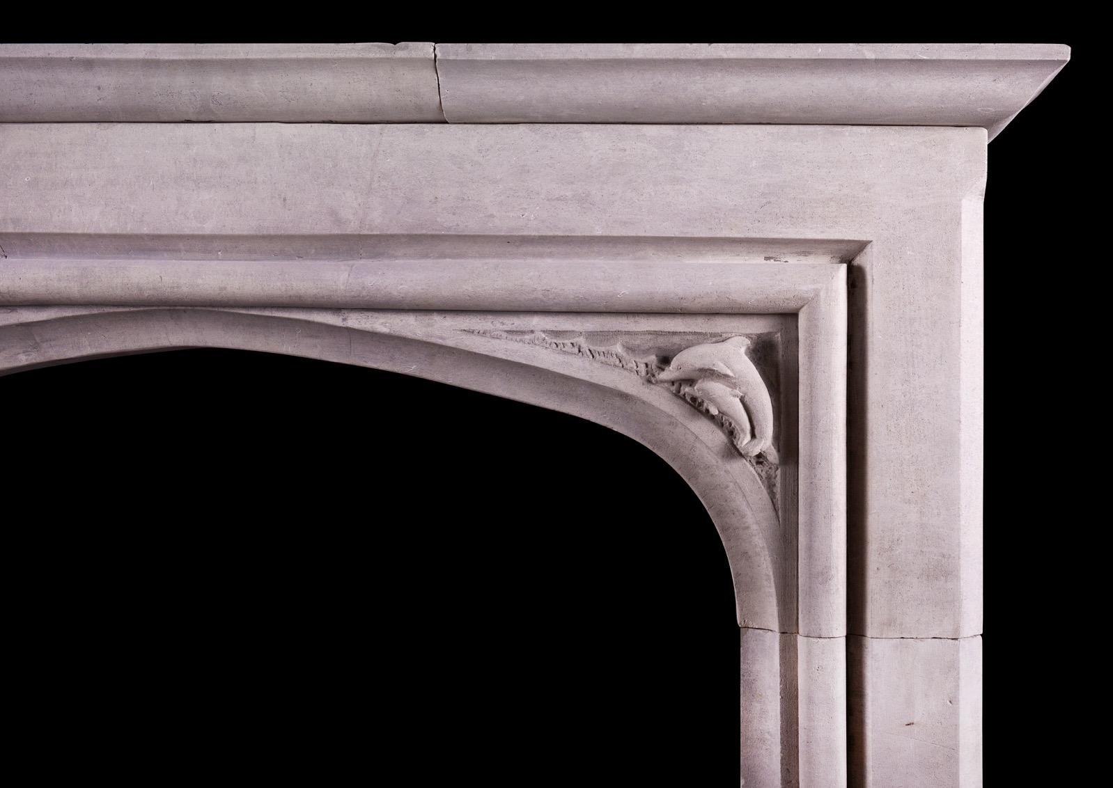 An unusual Portland stone fireplace in the Gothic manner. The arched frieze with spandrels featuring jumping dolphins with moulded legs below. Moulded shelf above. Small scale. English, circa 1900.

Shelf Width: 1360 mm 53 ½
