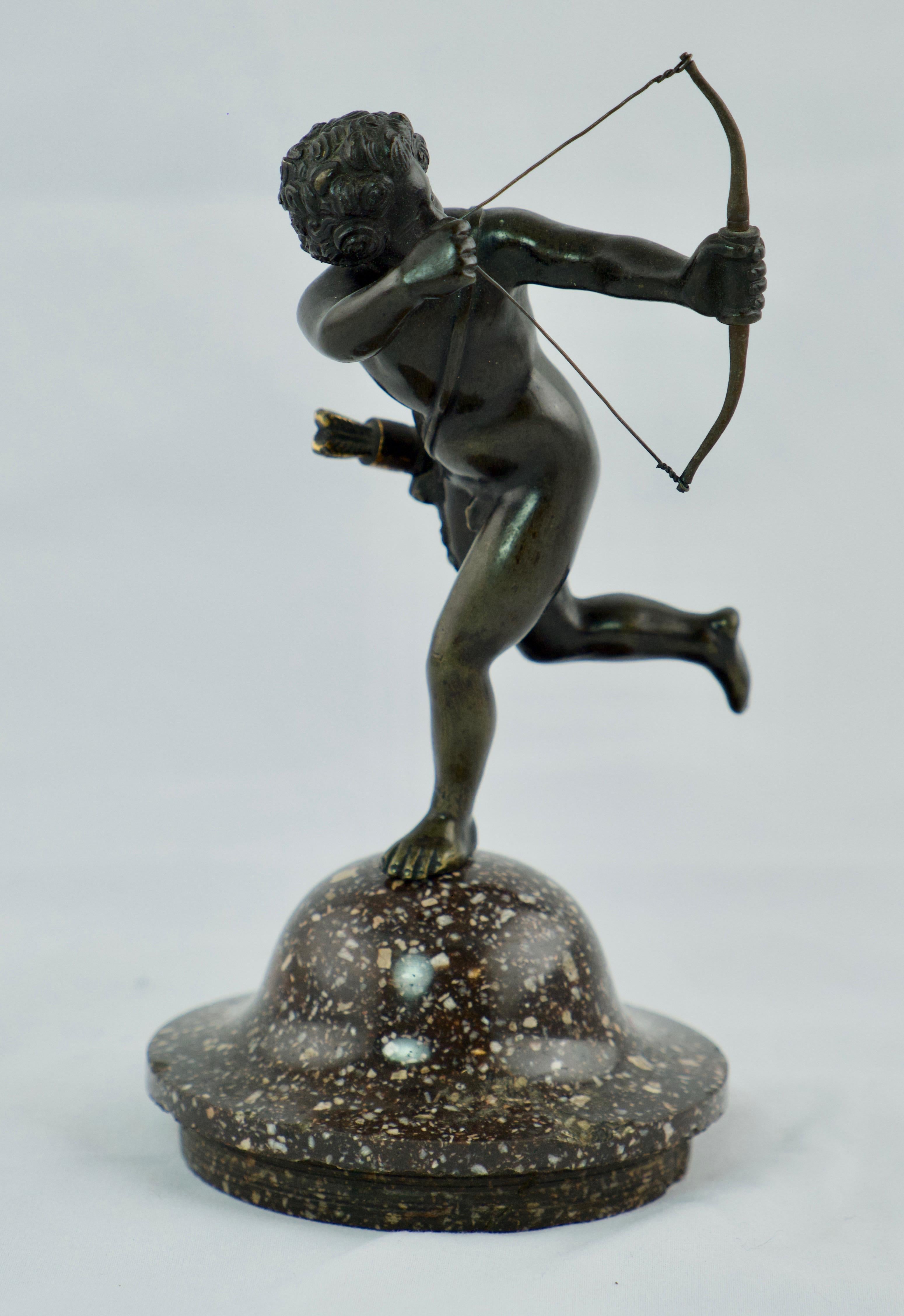 A charming small sculpture of Amour shooting love arrows with is bow. The sculpture has a base of Swedish porphyry.
The sculpture is 18th c the associated base is around year 1800.