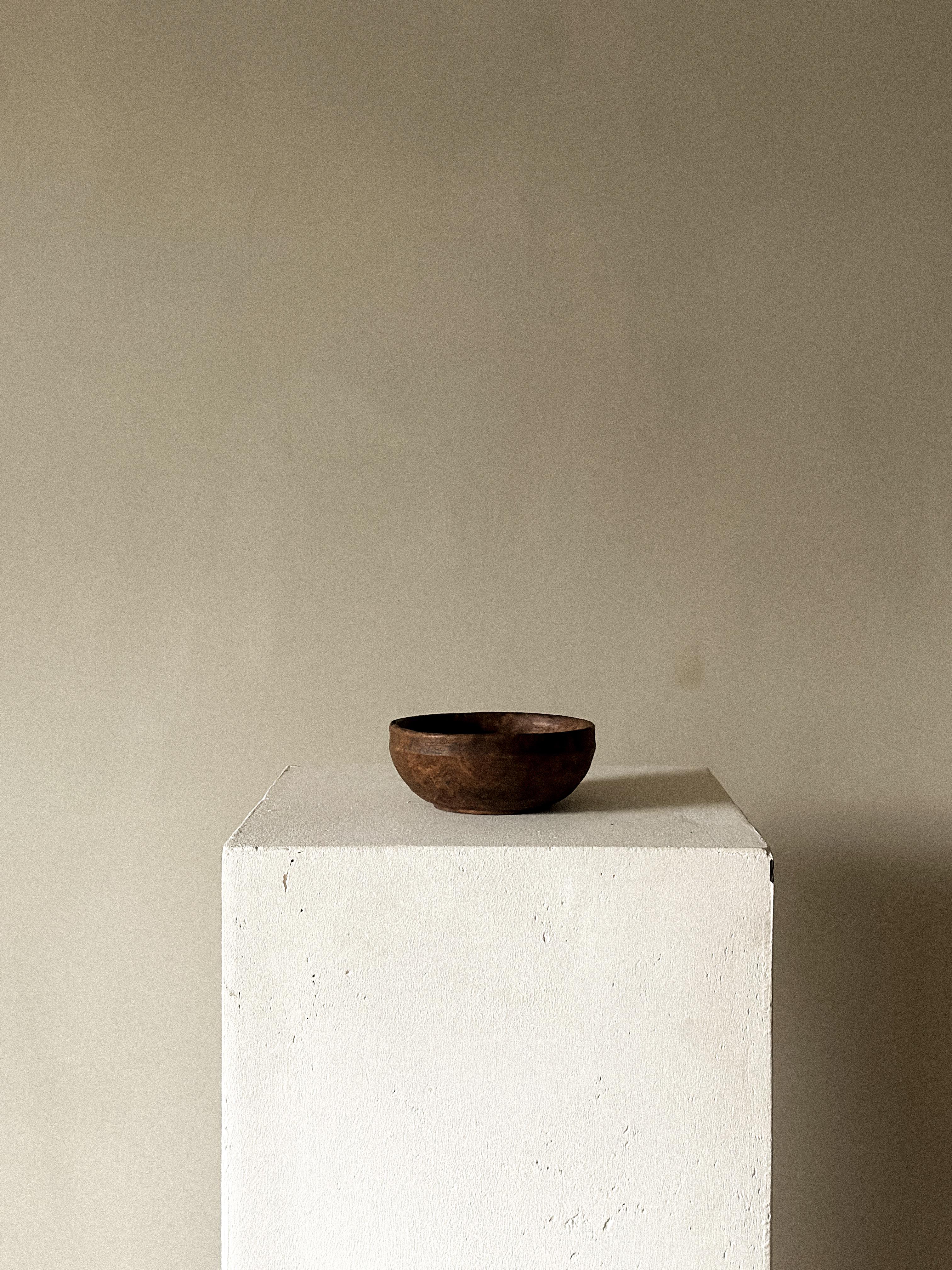 A small antique wabi sabi wooden bowl with beautiful patina from age and use. 