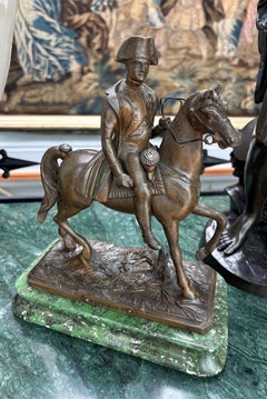 A small well cast late 19 Century Bronzed Metal Statue of Napoleon on horseback