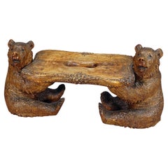 A Small Wooden Carved Black Forest Bench with Bears ca. 1900s