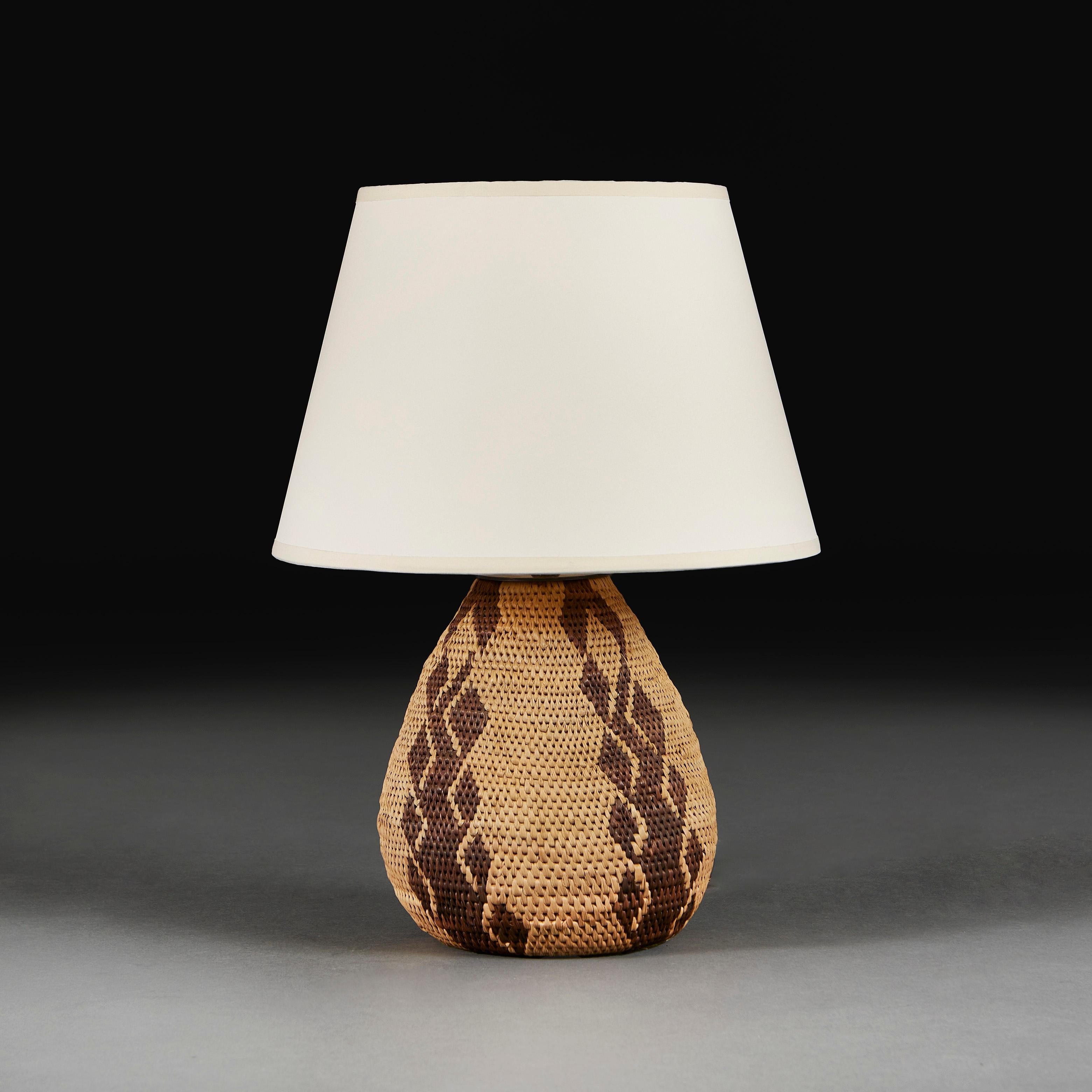 South Africa,

A mid twentieth century South African basket weave lamp of small scale and teardrop form, with geometric decoration.

Please note:
Does not include the lampshade. Lamp has been photographed with a 14” pale cream Pembroke card