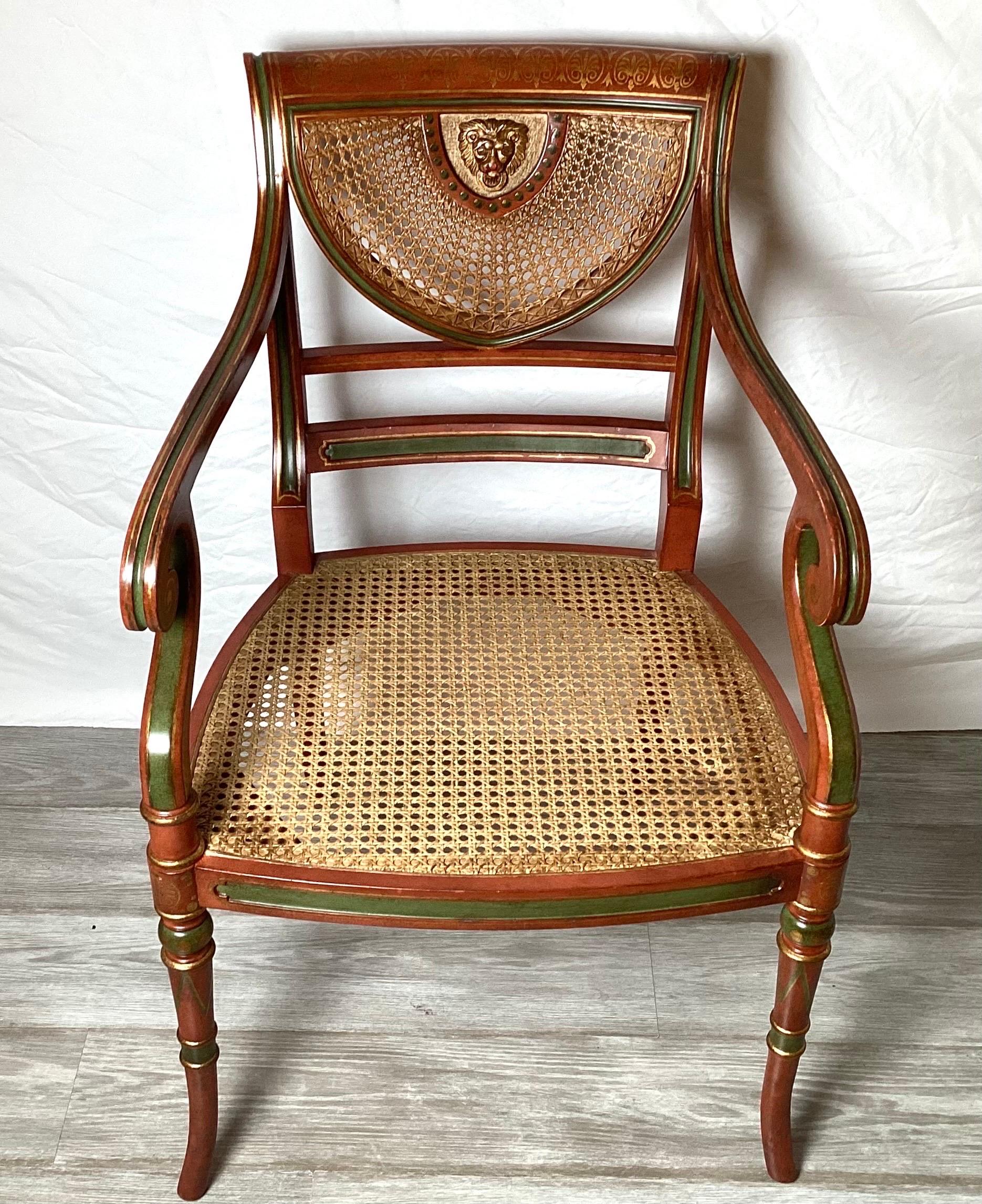 A Classic English Regency hand painted arm chair. Made by the expert cabinet maker, Smith and Watson NYC. The cane seat and back in very good condition, would require a seat cushion.