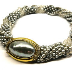 A soft grey baroque pearl and clear crystal 'twist' necklace, Ciner, USA, 1980s