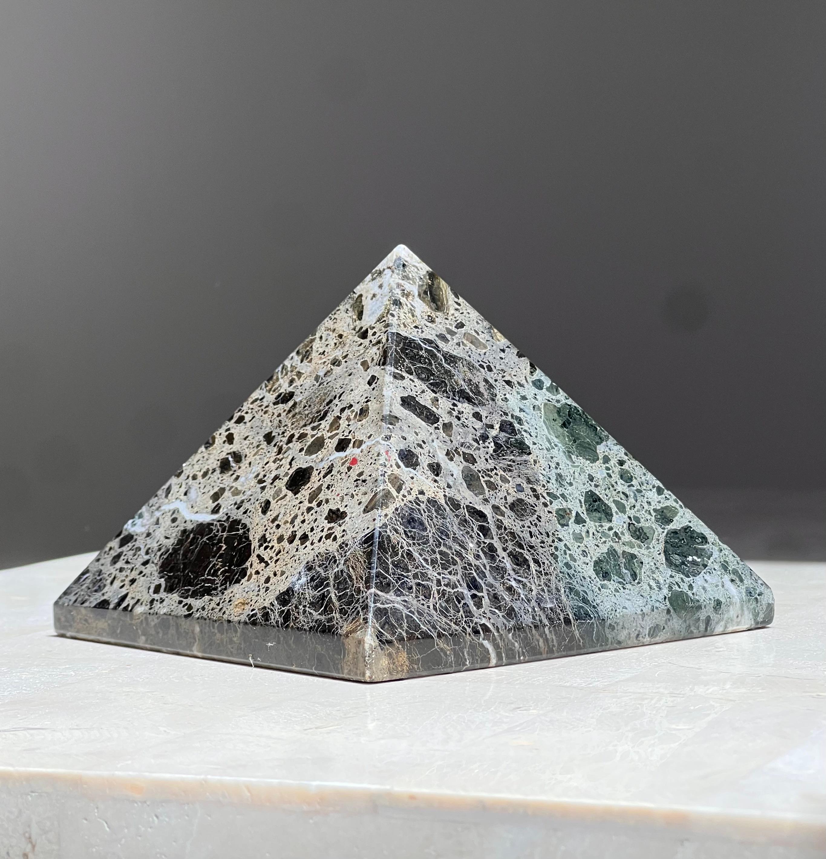 A glorious marble pyramid sculpture, mid 20th century. In tones of pewter, licorice, and verdigris. Lovely as a paperweight or an objet d’art. 