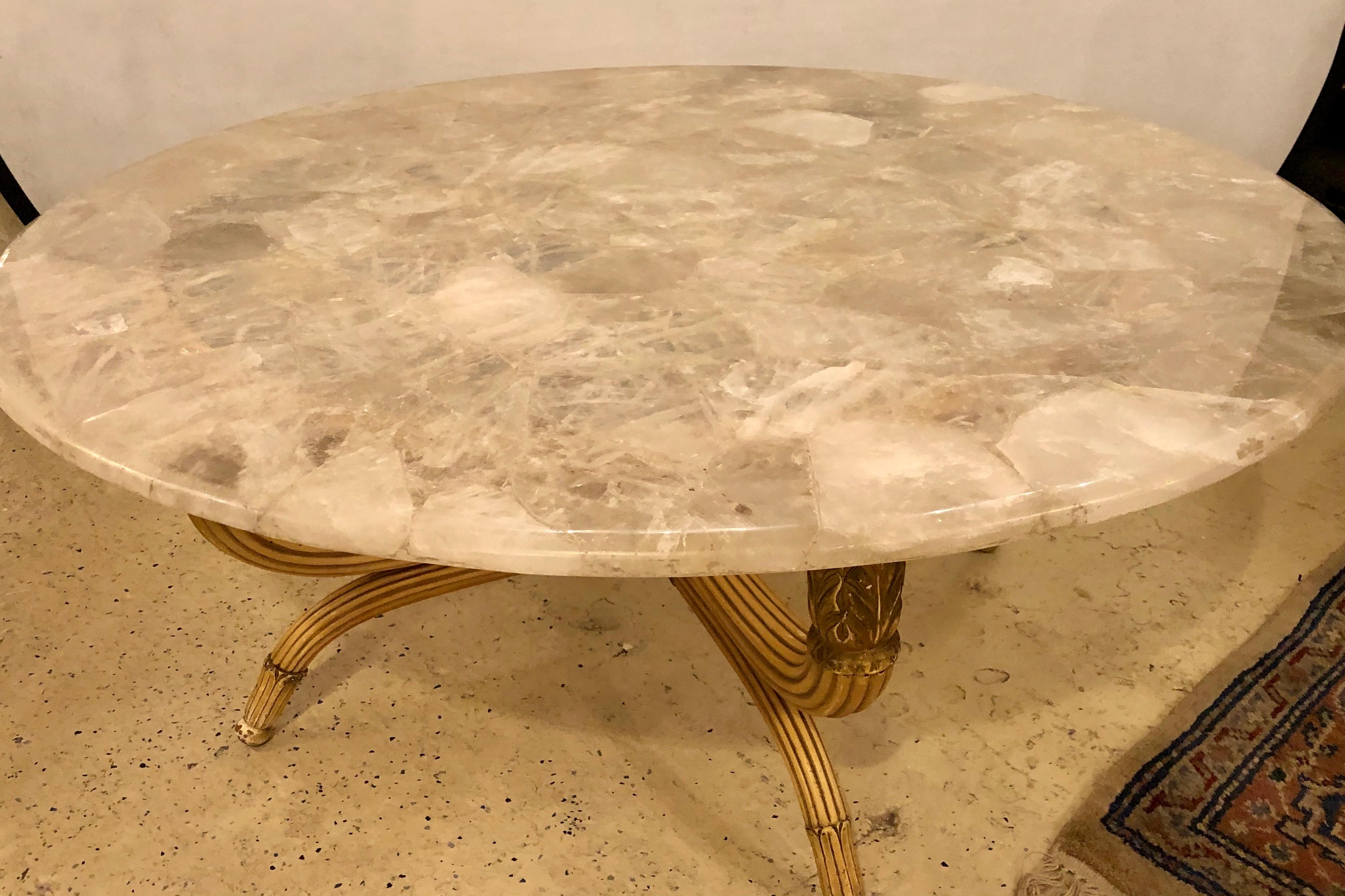 A solid rock crystal circular table top that can be made into a coffee, dining or centre table. One simply needs a base to depict this stunning one of a kind 48 inch table top of circular form in a sold white rock crystal. The top here seen with a