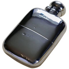 A Solid Silver Brandy Hip Flask and Cup by Finnigans ltd, 1900