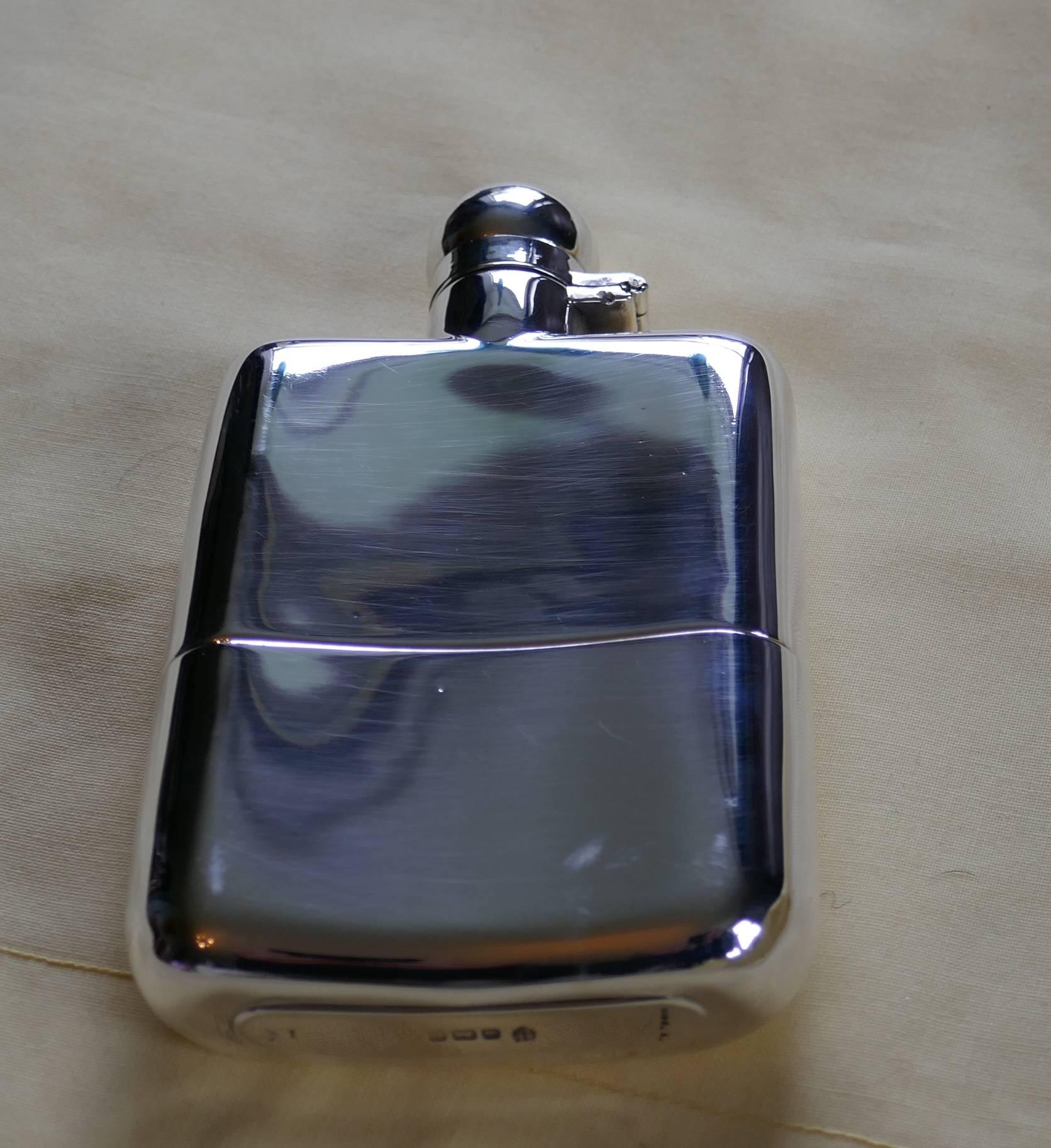 A Solid Silver Hall Marked Hip Flask and Cup by Stewart Dawson & Co, 1912

A lovely piece the flask has a slight curve, hinged lid with turning locking grip and a good size cup, which pulls out from the base. The flask is made by “ Stewart Dawson &