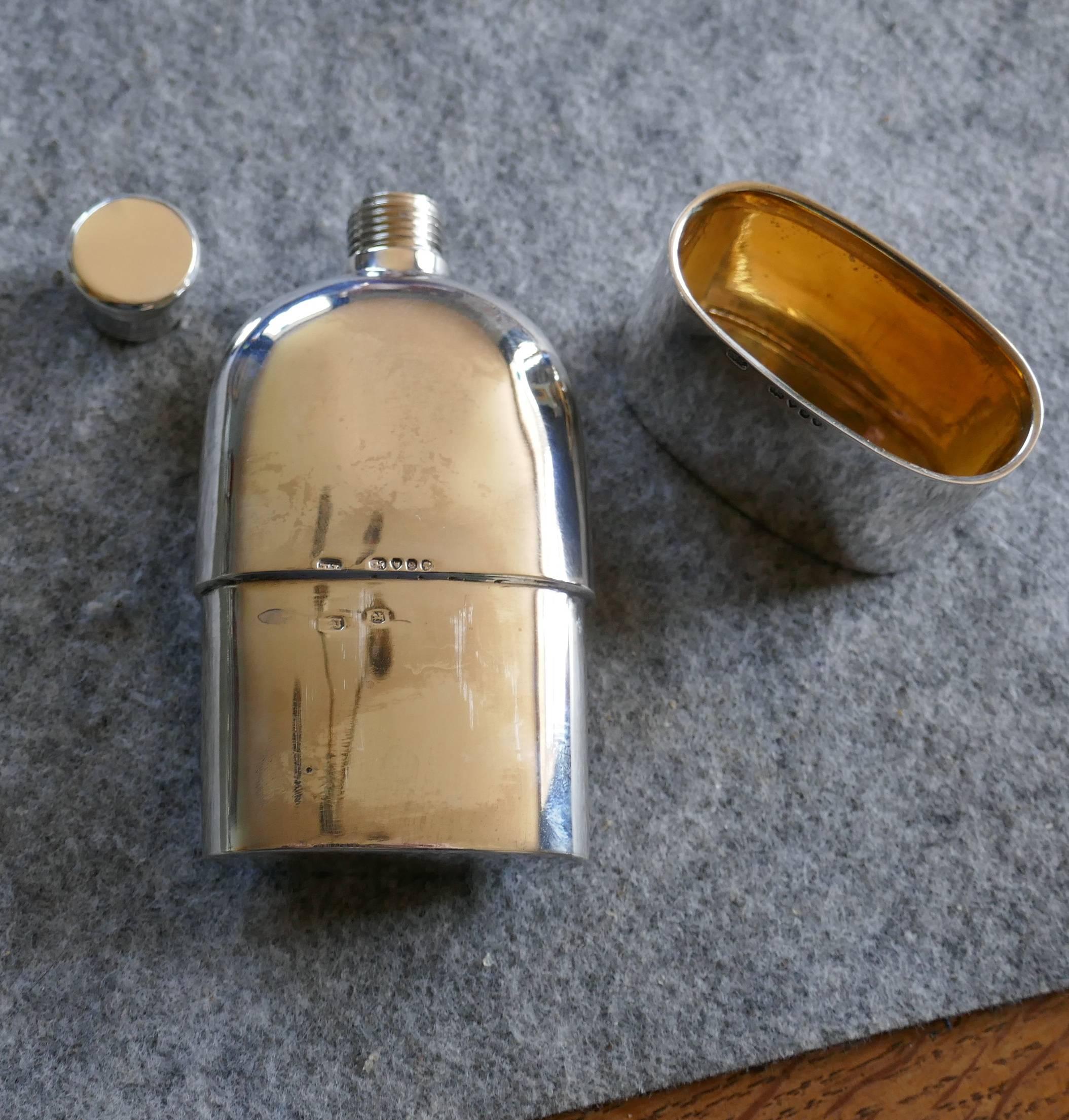 A solid silver hallmarked pocket or hip flask and cup date 1888

A lovely piece the flask has a rounded shape, making it ideal to keep in either a breast or hip pocket, or even handbag. The lid has a screw grip and a cup which pulls out from the