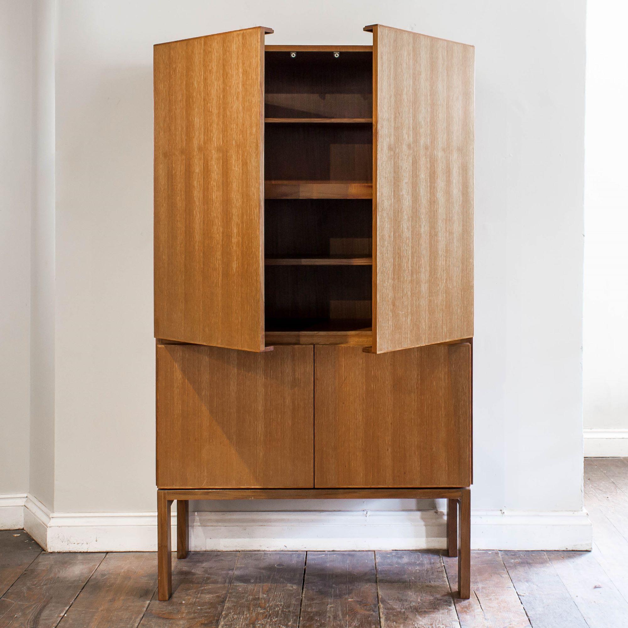 The simple four doors enclosing shelves on simple straight legs.

England, Designed in 1969. This model dates from the 1970s.

Designed as part of the GR69 Series by Robert Heritage for Gordon Russell. This series of furniture was so expensive