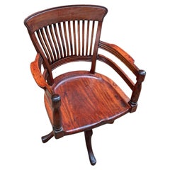 A solid Walnut 19th E. W Godwin Swivel Desk Chair