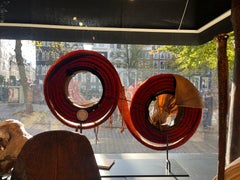 A Solomon Islands red feather money coil or 'Tevau'