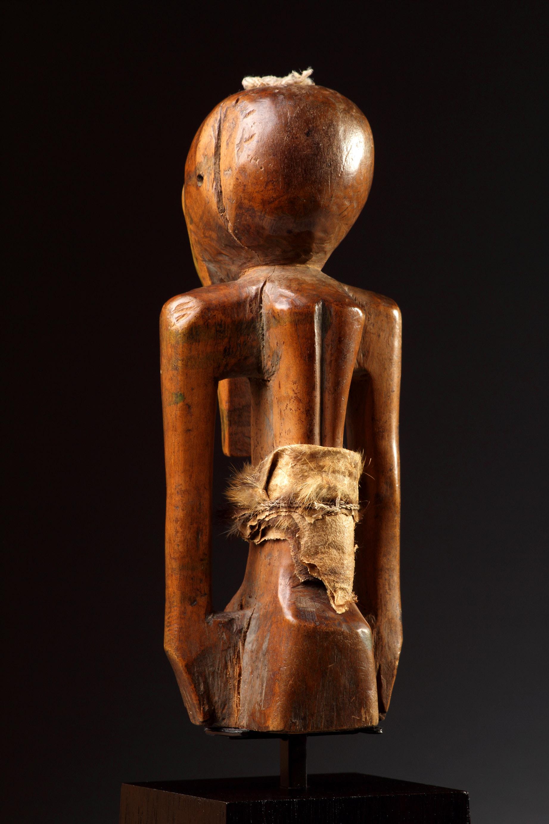 Wood A South Eastern Congo, Zaire Songye Protective Fetish Figure ‘Nkishi’ of Geometr For Sale