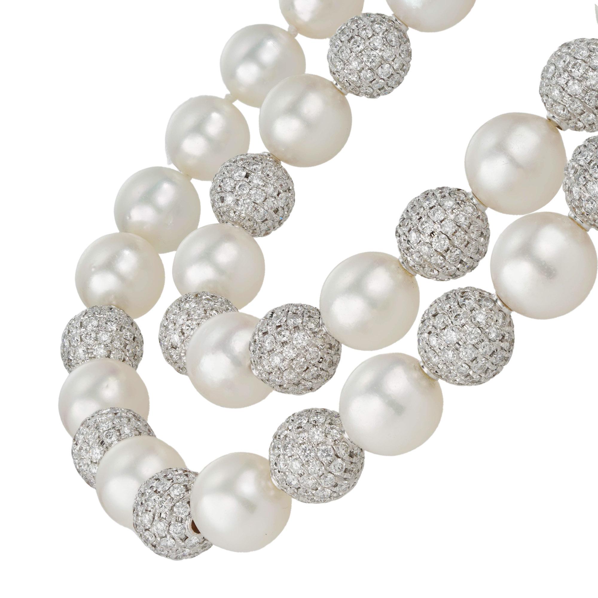 A South Sea cultured pearl and diamond necklace, the thirty-three cultured South Sea pearls graduating from 10 to 11mm, strung with twenty-two diamond-set beads, to a single pearl hidden clasp, the small round brilliant-cut diamonds estimated to