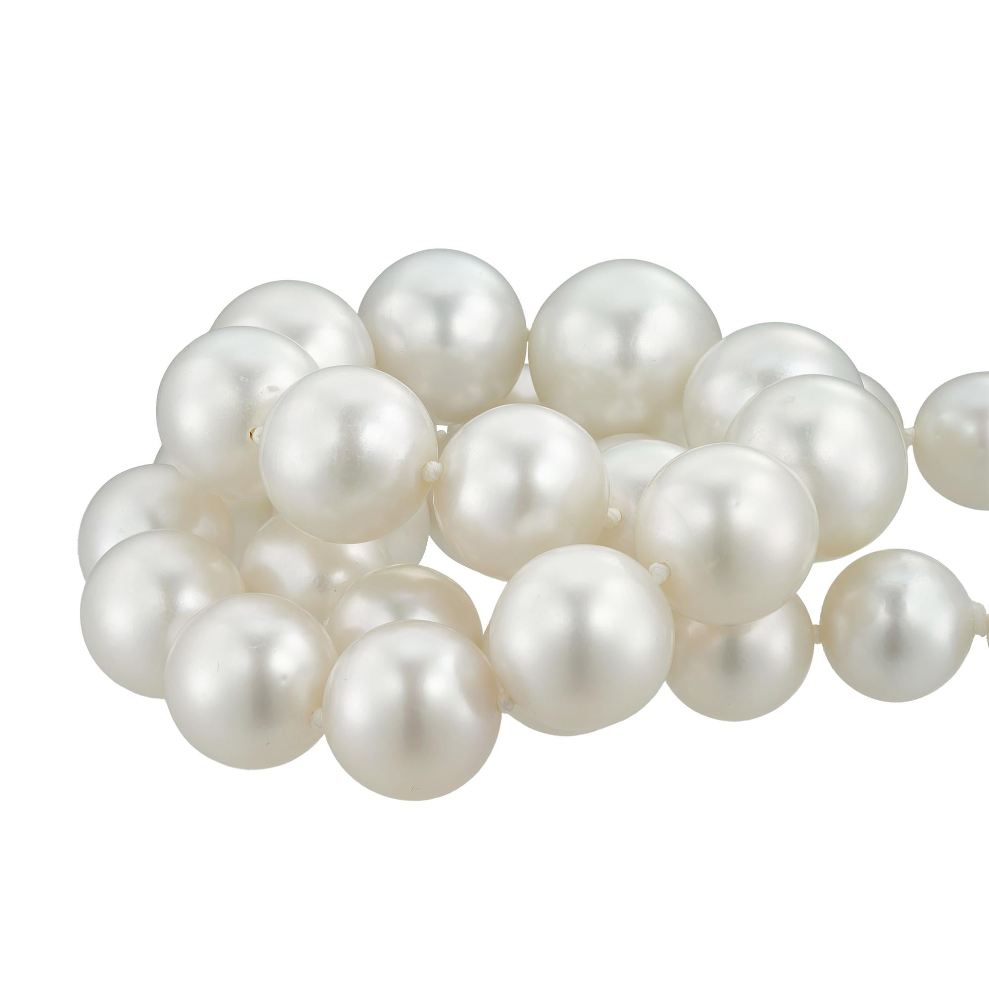 A South Sea cultured pearl and diamond  necklace, consisting of thirty-one South Sea cultured pearls graduating in size from 16.6mm to 11.9mm, all strung and knotted to a platinum ball clasp pave-set with small brilliant-cut diamonds estimated to