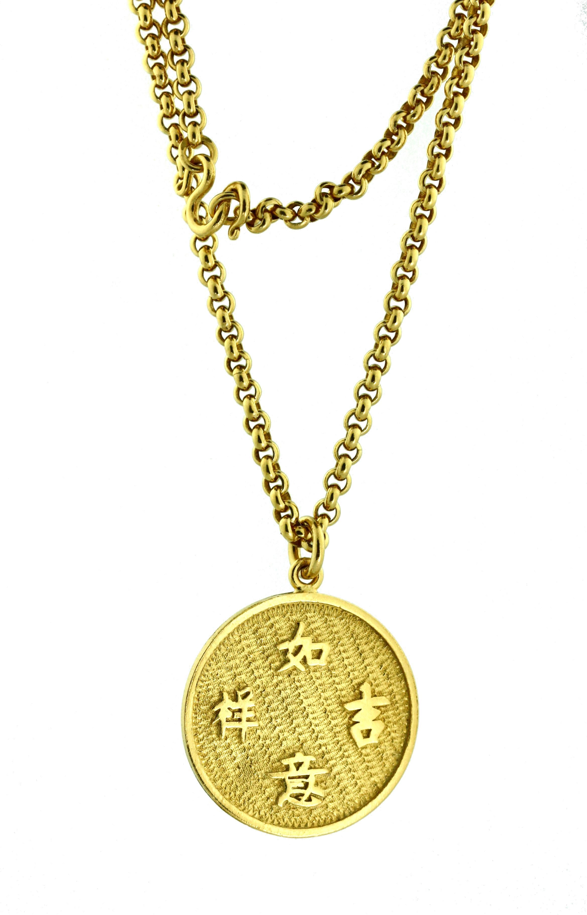 
A SouthEast Asian 24 karat gold pendant with necklace, Chinese, 20th century, necklace of braided gold links, pendant with four Chinese characters, Length approximately 14 inches,
gross weight approximately 29.3 dwts, 45 grams