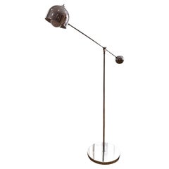 A space age chrome floor lamp in the style of Robert Sonneman, circa 1960s