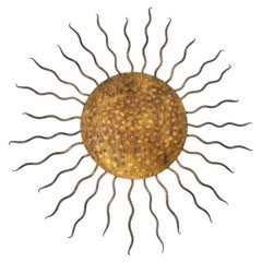 A Spanish 1950s gilt wrought iron sunburst wall / ceiling light.