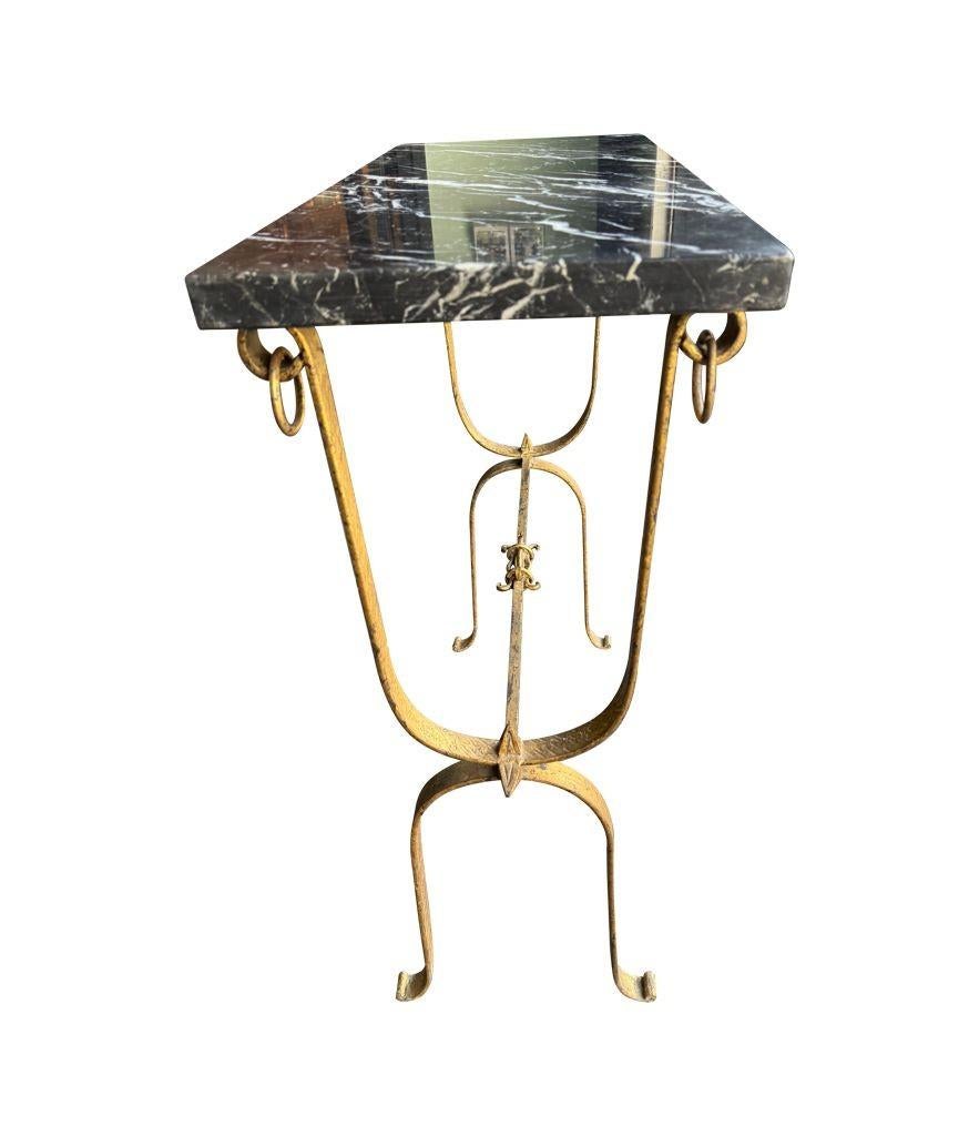 A Spanish 1950s wrought iron gilt console table with Nero Marquina marble top For Sale 4
