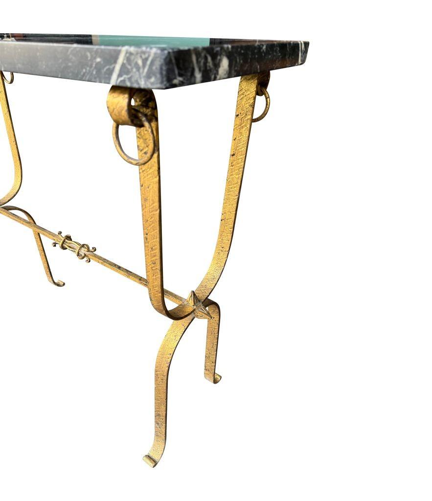 A Spanish 1950s wrought iron gilt console table with Nero Marquina marble top For Sale 5