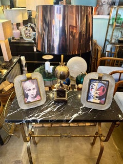 A Spanish 1950s wrought iron gilt console table with Nero Marquina marble top