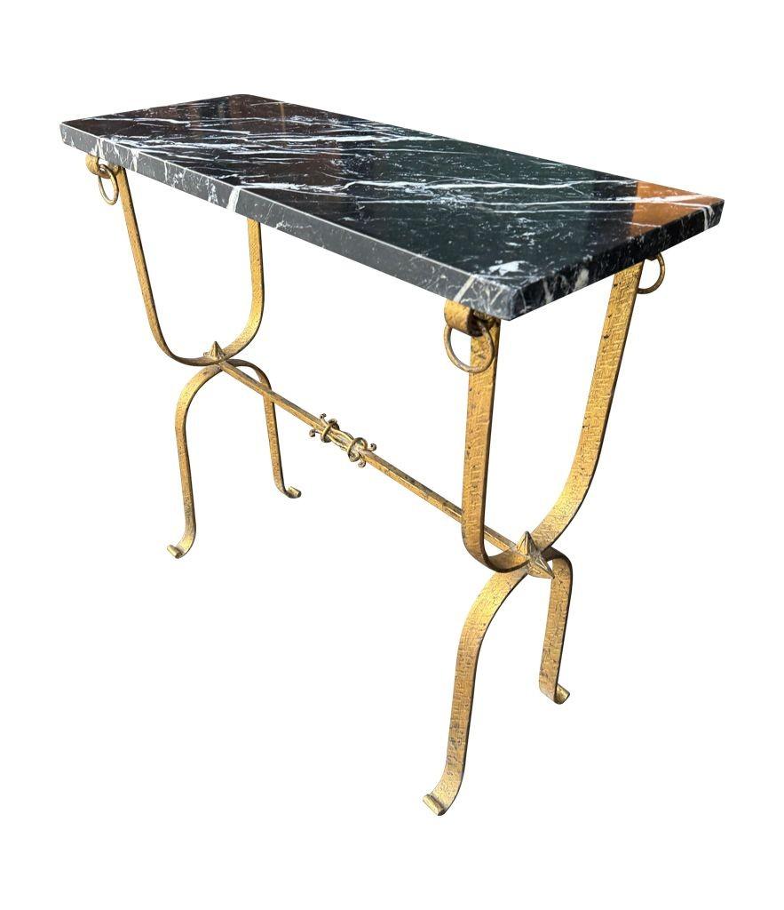 Wrought Iron A Spanish 1950s wrought iron gilt console table with Nero Marquina marble top For Sale