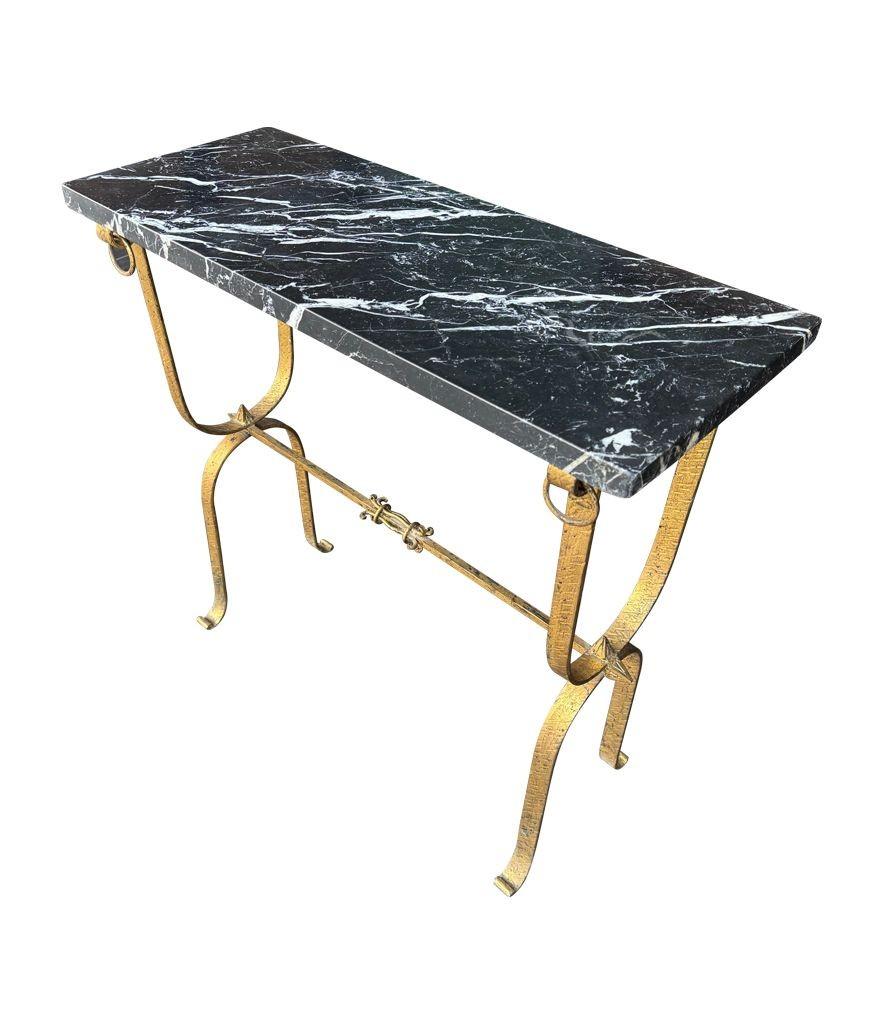 A Spanish 1950s wrought iron gilt console table with Nero Marquina marble top For Sale 2
