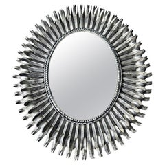 A Spanish 1960s silvered metal oval portrait or landscape eyelash mirror