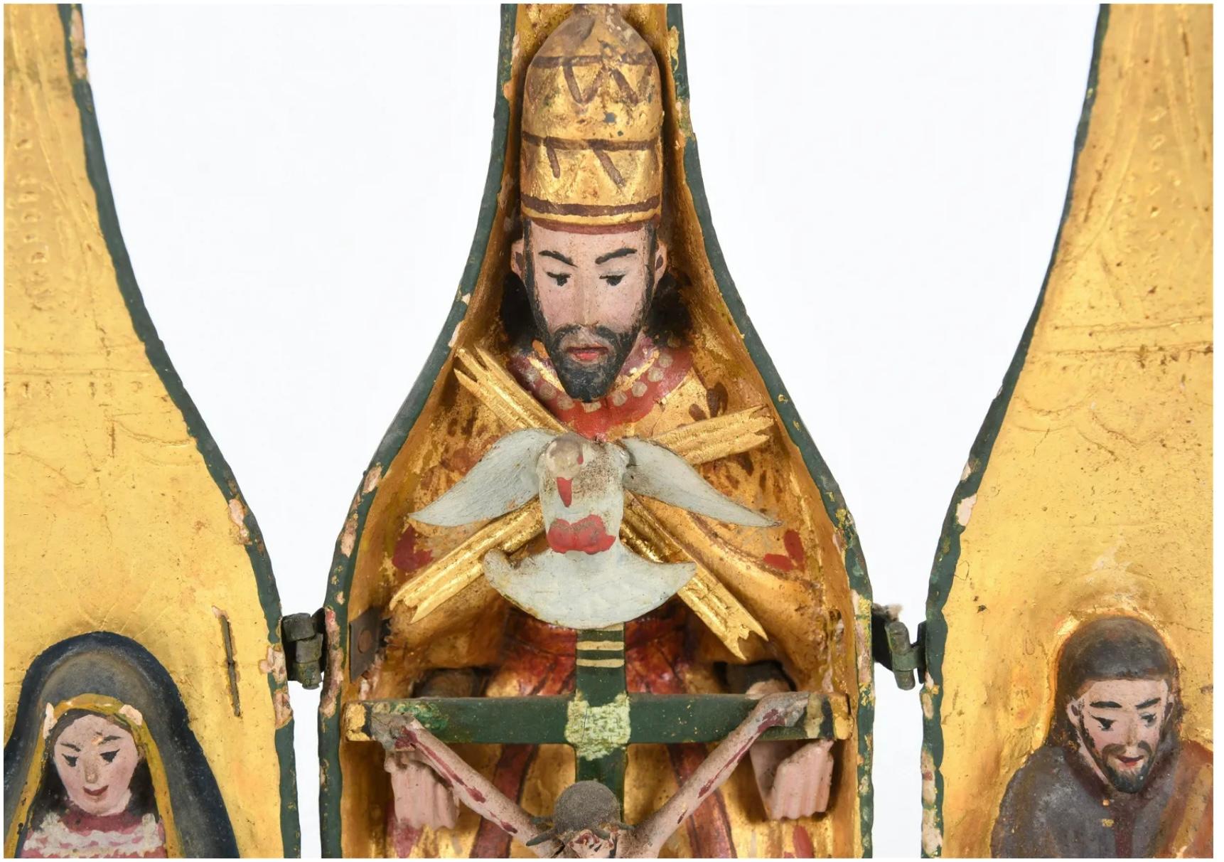 Late 19th century Spanish Colonial bottle form Triptych (A triptych is a work of art divided into three sections, may be hinged together and can be folded or shut or displayed open), the green painted wooden bottle opens to reveal a central Christ