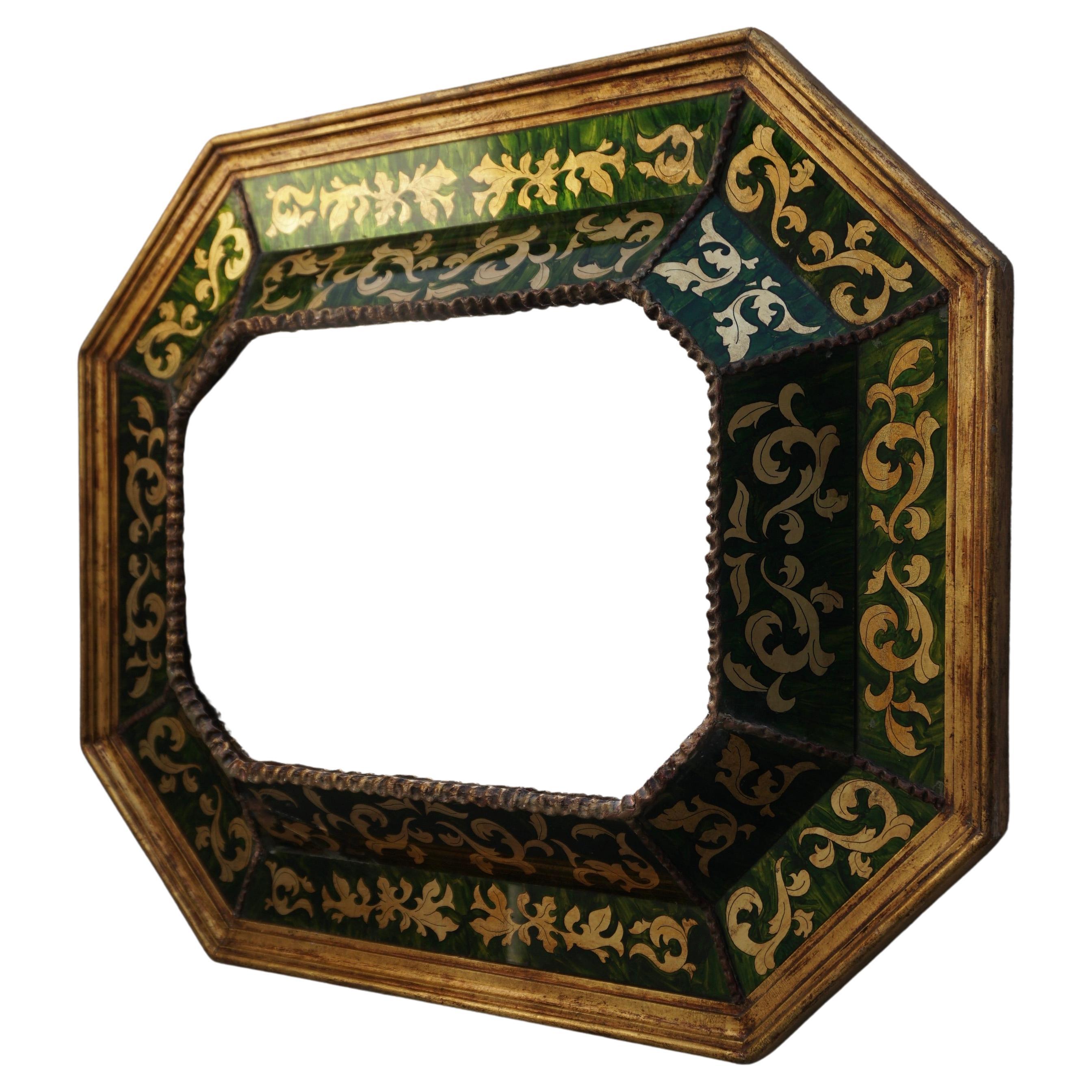 A Spanish verre eglomise gilded mirror c. 1930

Dimensions
63 cm h x 79 cm w 7 cm d
