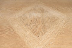 A Spanish Oak Wood Table with Two Leaf Extensions