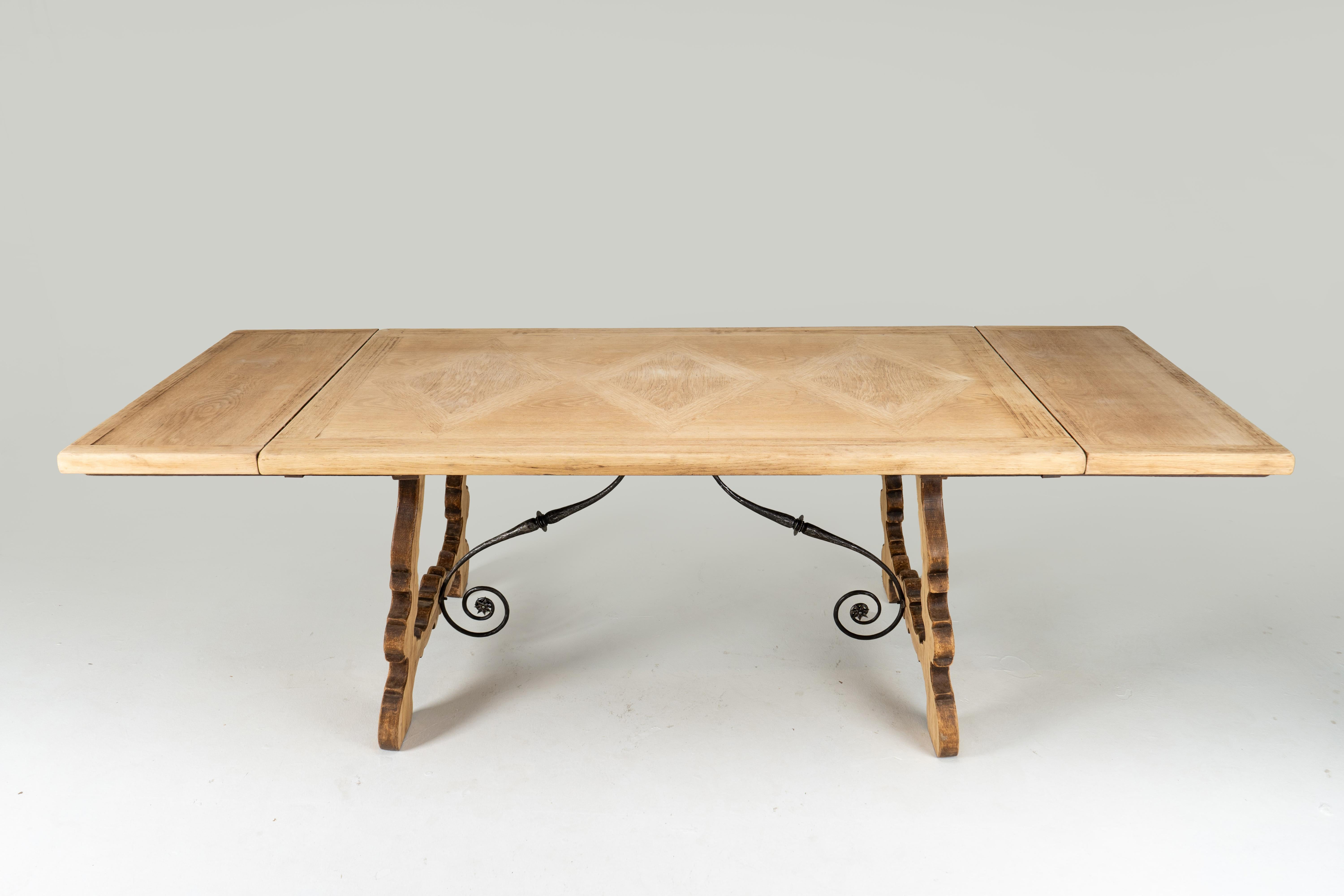 Metal A Spanish Oak Wood Table with Two Leaf Extensions For Sale