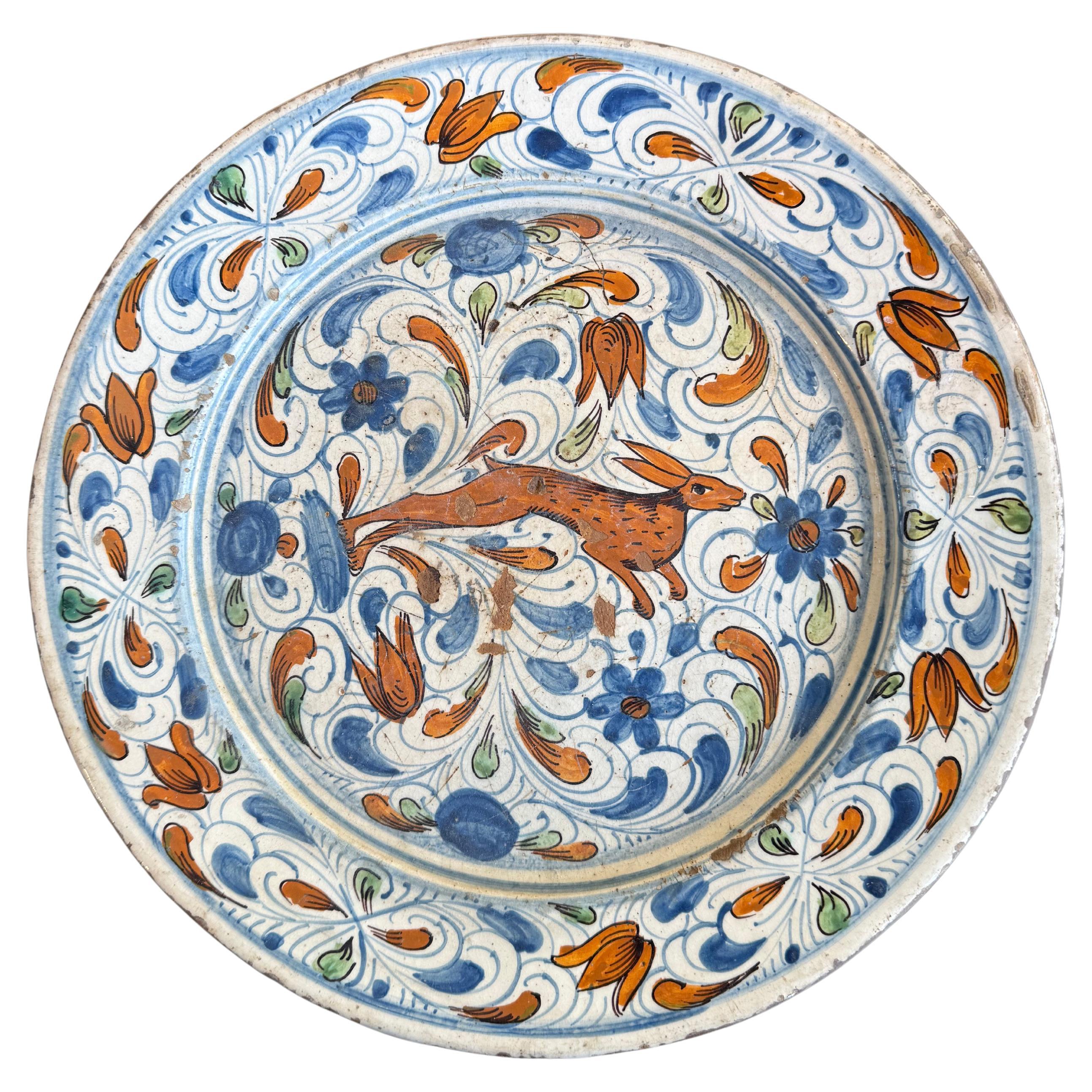 A Spanish Polychrome Earthenware Plate, 18th Century