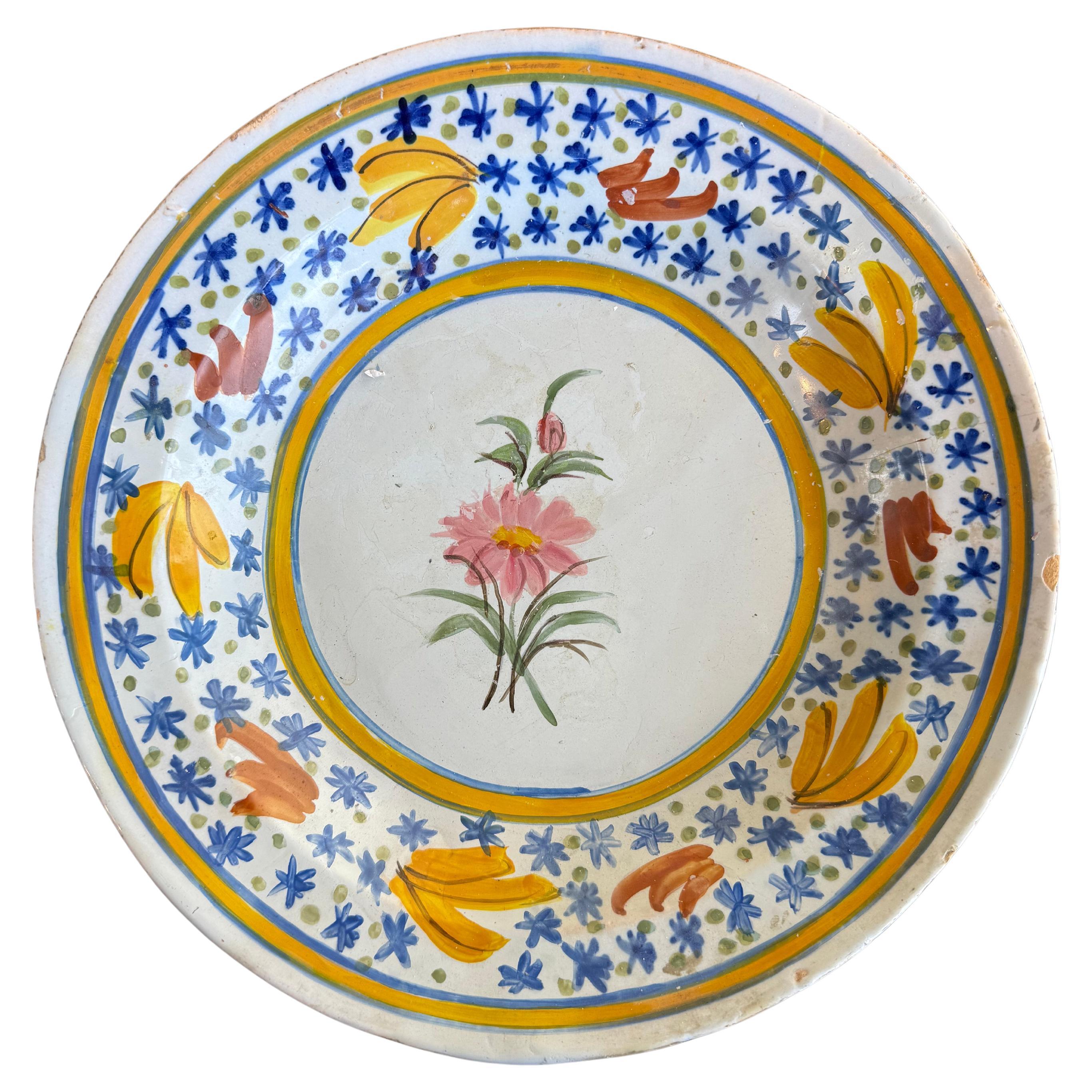 A Spanish Polychrome Earthenware Plate, 19th Century