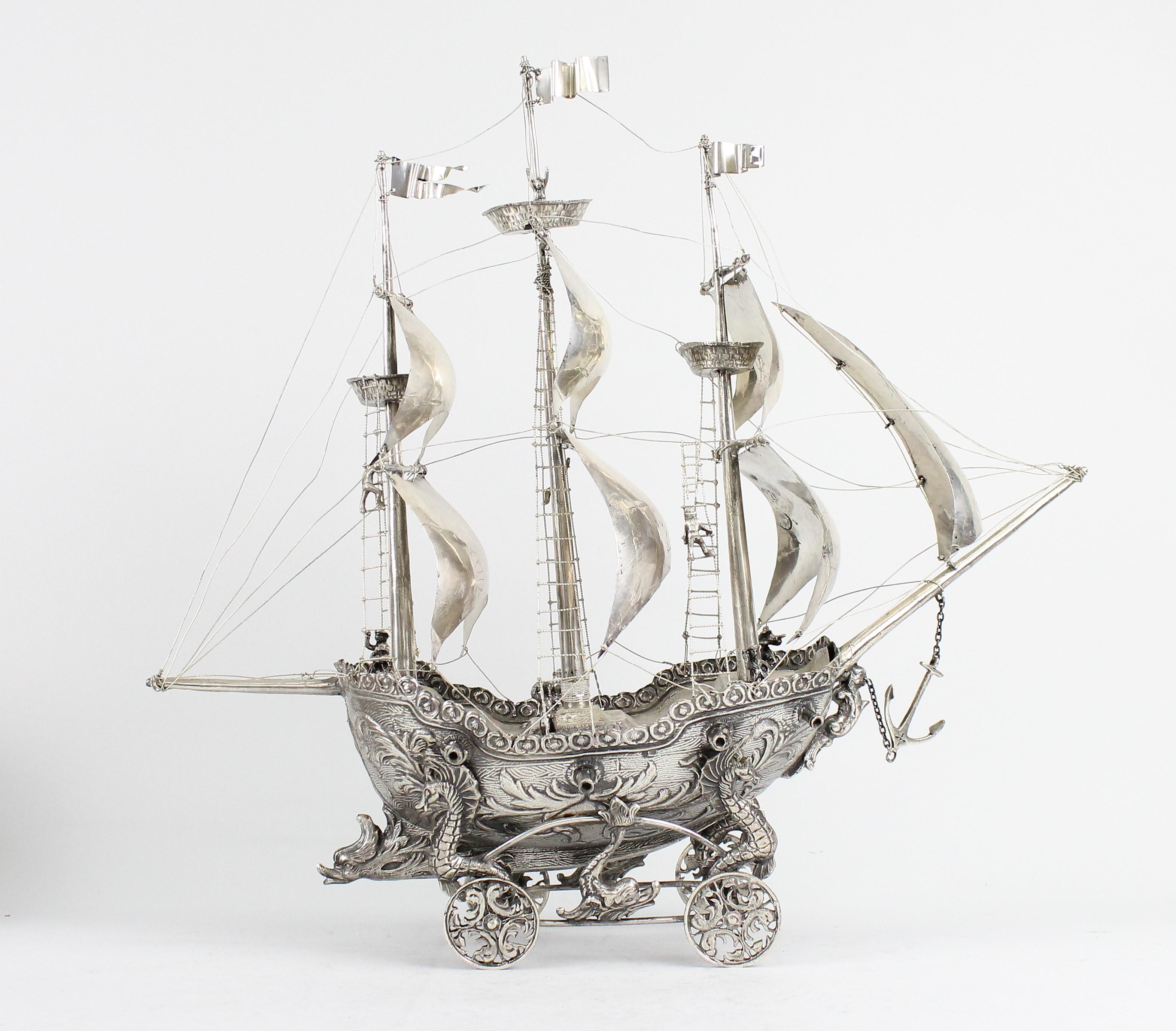 An unusual Spanish silver Nef.
A nice centerpiece that will make a great statement!
With silver maker marks and Spanish pentagram marks (91.5% silver).
Made in the first half of the 20th century.
Weight 867 grams.
Formed as a three-masted galleon