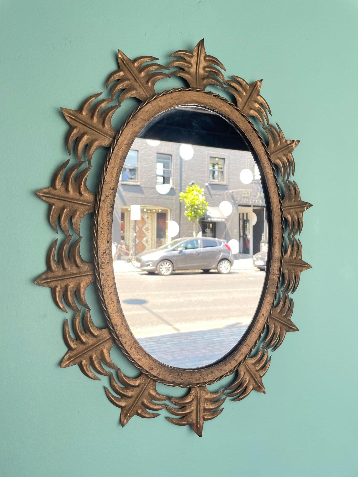 Mid-20th Century Spanish Sunburst 1950s Gilt Metal Oval Mirror with Ornate Edging For Sale