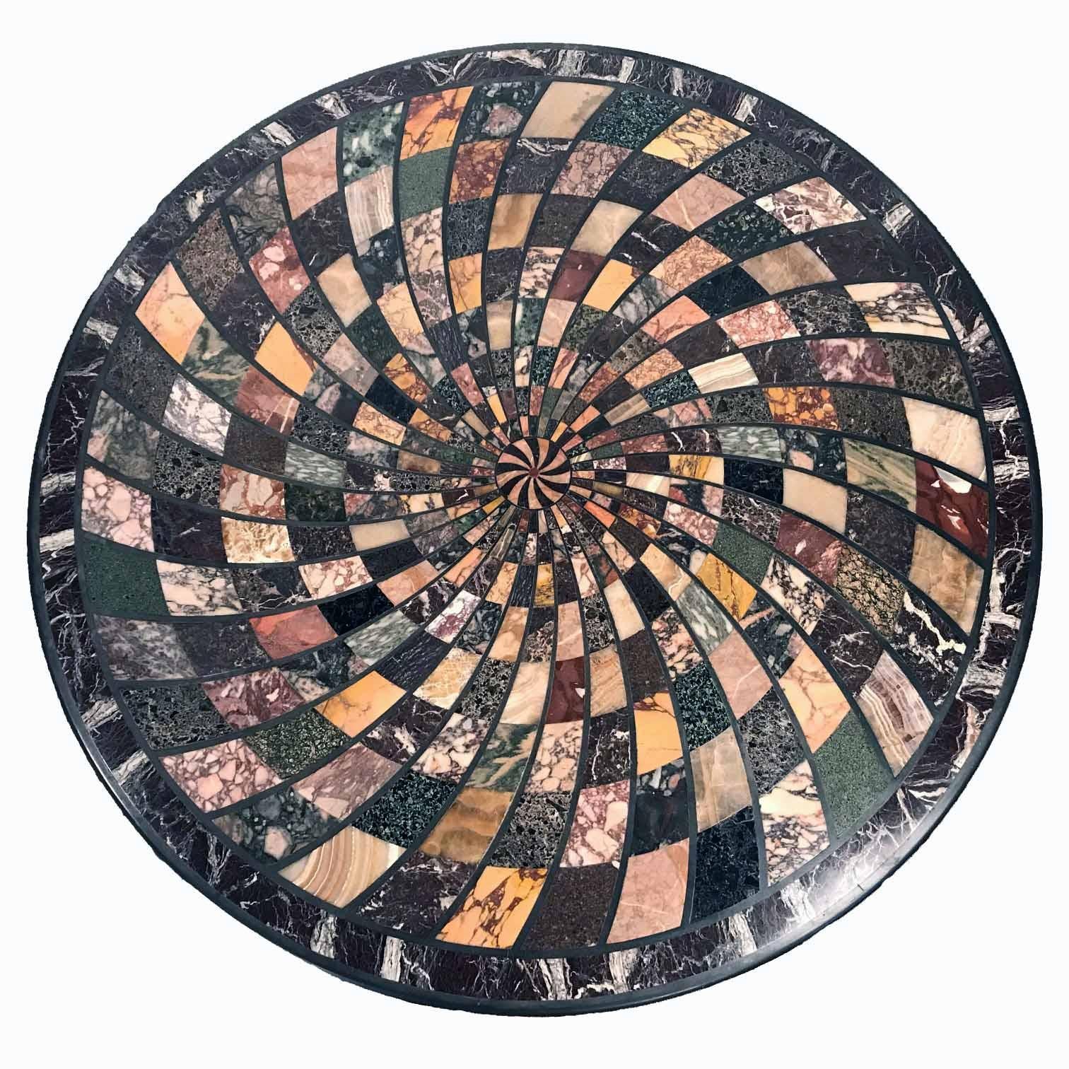 This is a rare and superb survival. Not merely do we have this intricately inlaid parquetry top, resplendent with various coloured marbles, but we even have the original walnut center table on which it stood. Unlike the laser-carved version, these
