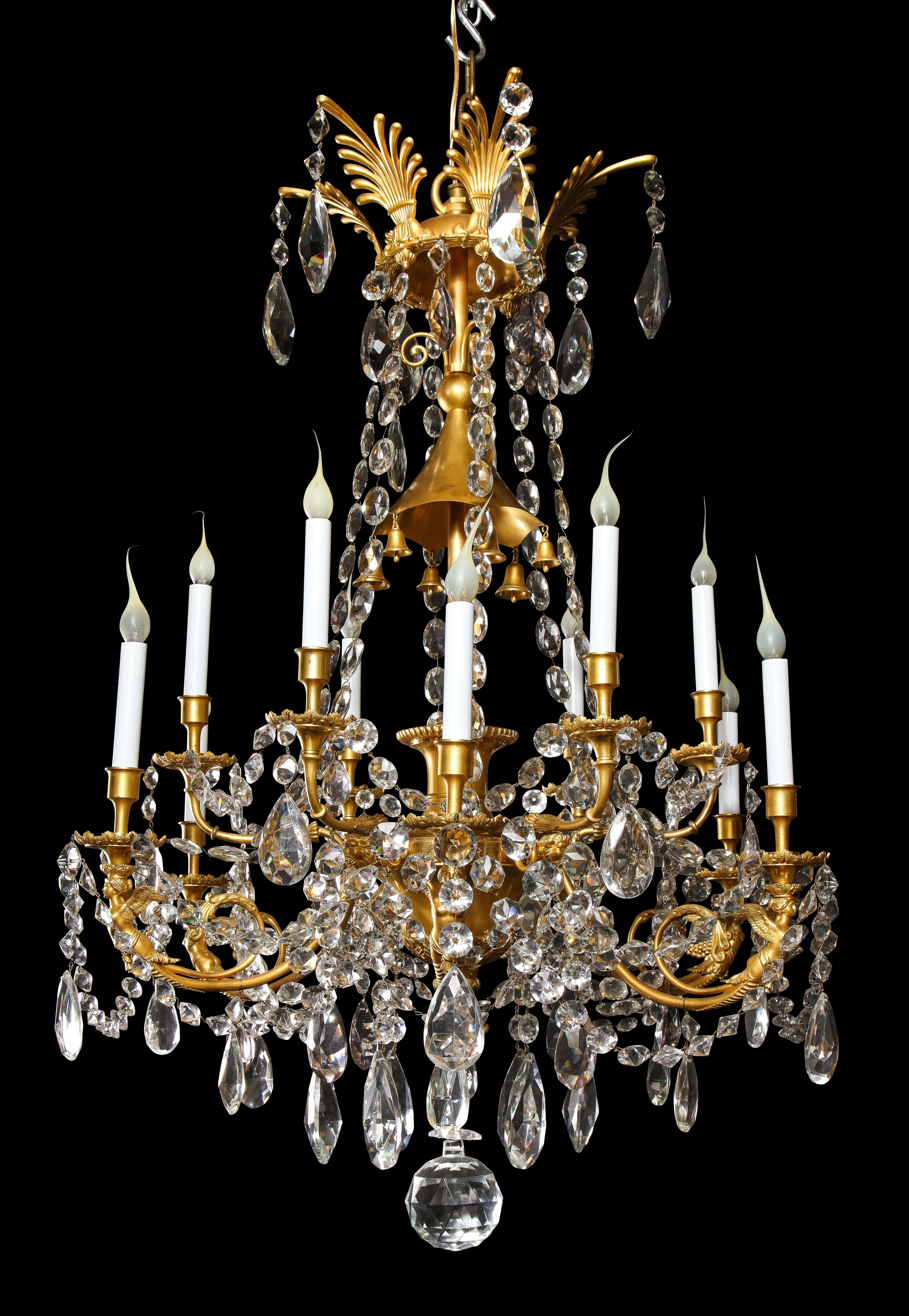 A Spectacular and Large Antique French Louis XVI style gilt bronze and cut crystal figural multi light double tier chandelier of exquisite craftsmanship. This unique chandelier is embellished with gilt bronze neoclassical figures and further adorned
