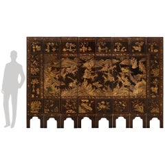 A spectacular Chinese 18th century Coromandel Lacquered 8-panel floor screen