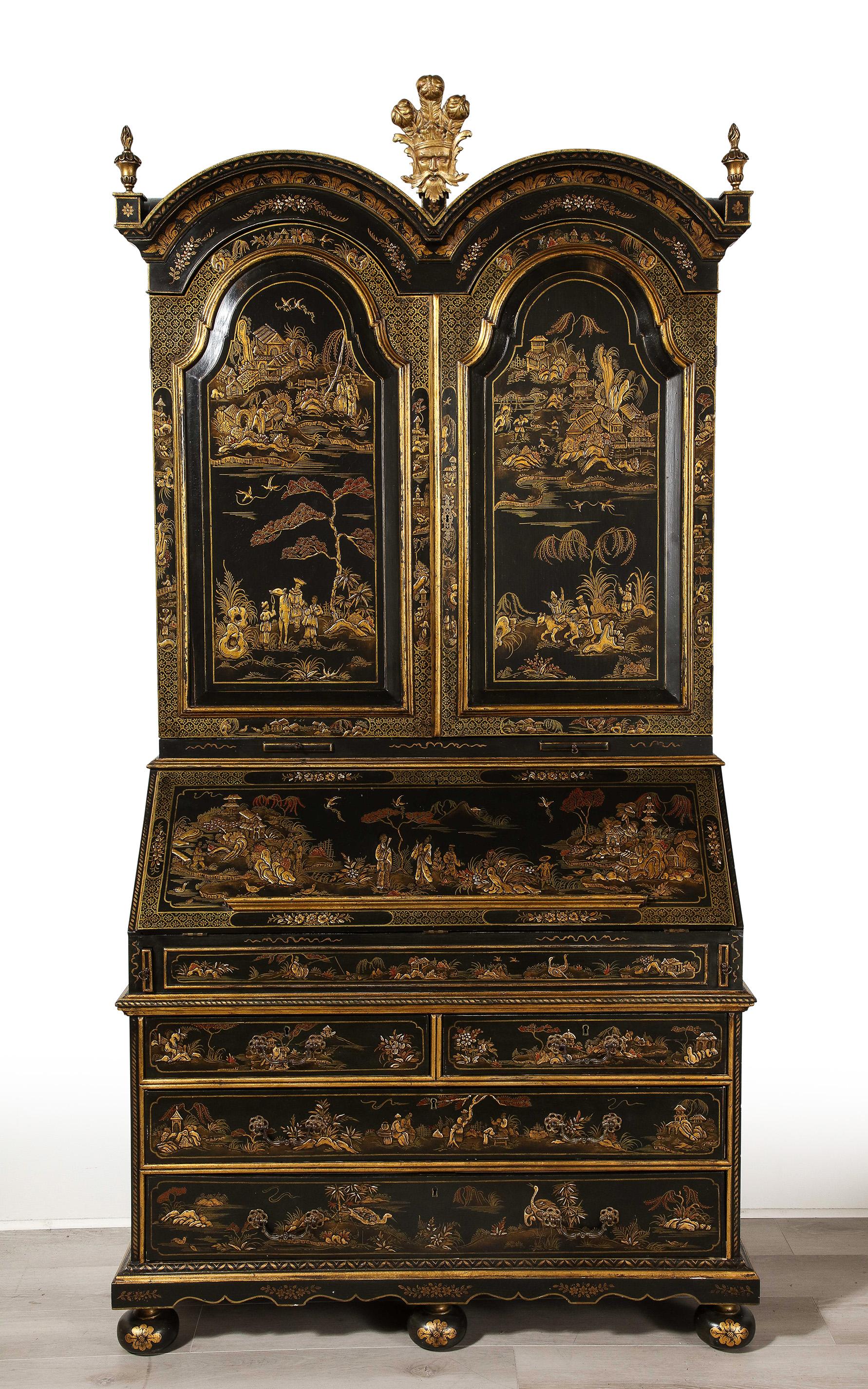 This impressive  and grand Chinoiserie Secretary having an intricate detailed decoration both on the exterior and interior, the top section with  2 doors opening to reveal a fitted interior with many hidden drawers and compartments, over a fall