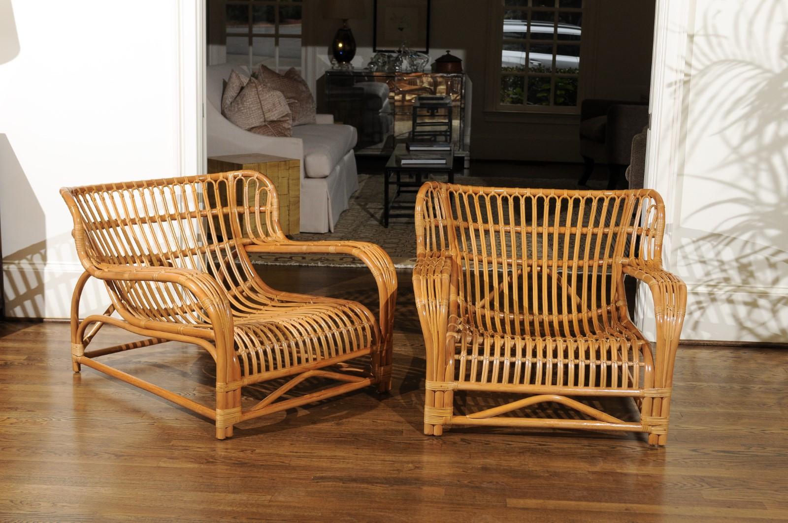 A spectacular pair of custom made rattan lounge chairs, circa 1995. This particular design was inspired by the groundbreaking Viggo Boesen model VB 136 chair originally produced by E.V.A. Nissen and initially delivered in 1936. This fabulous pair