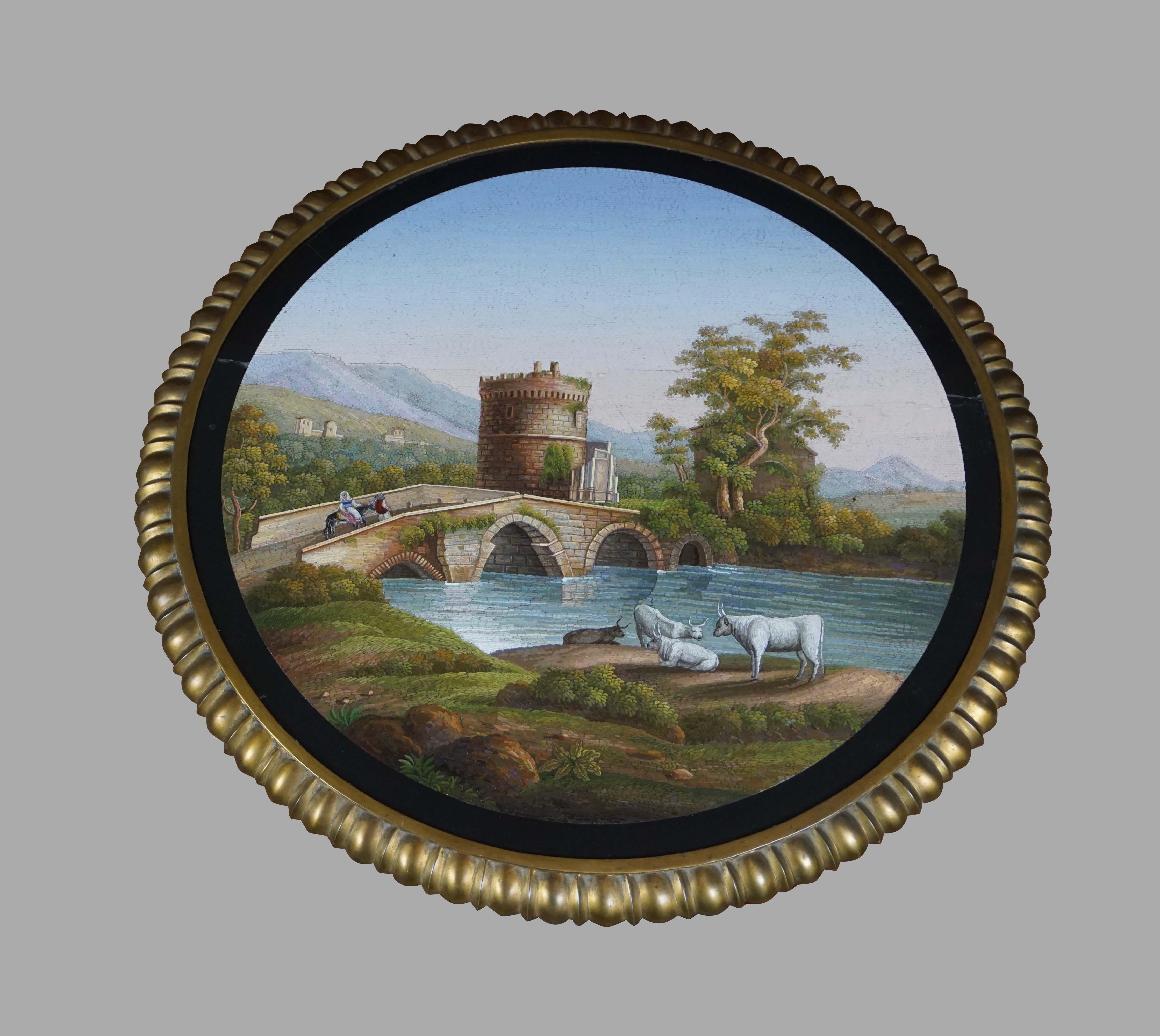 A magnificent pair of Italian micromosaic large plaques of the finest quality mounted on bronze and marble bases. One depicting a bucolic river scene with grazing cows, a bridge and ruin in the background. The other, a classical temple surrounded by